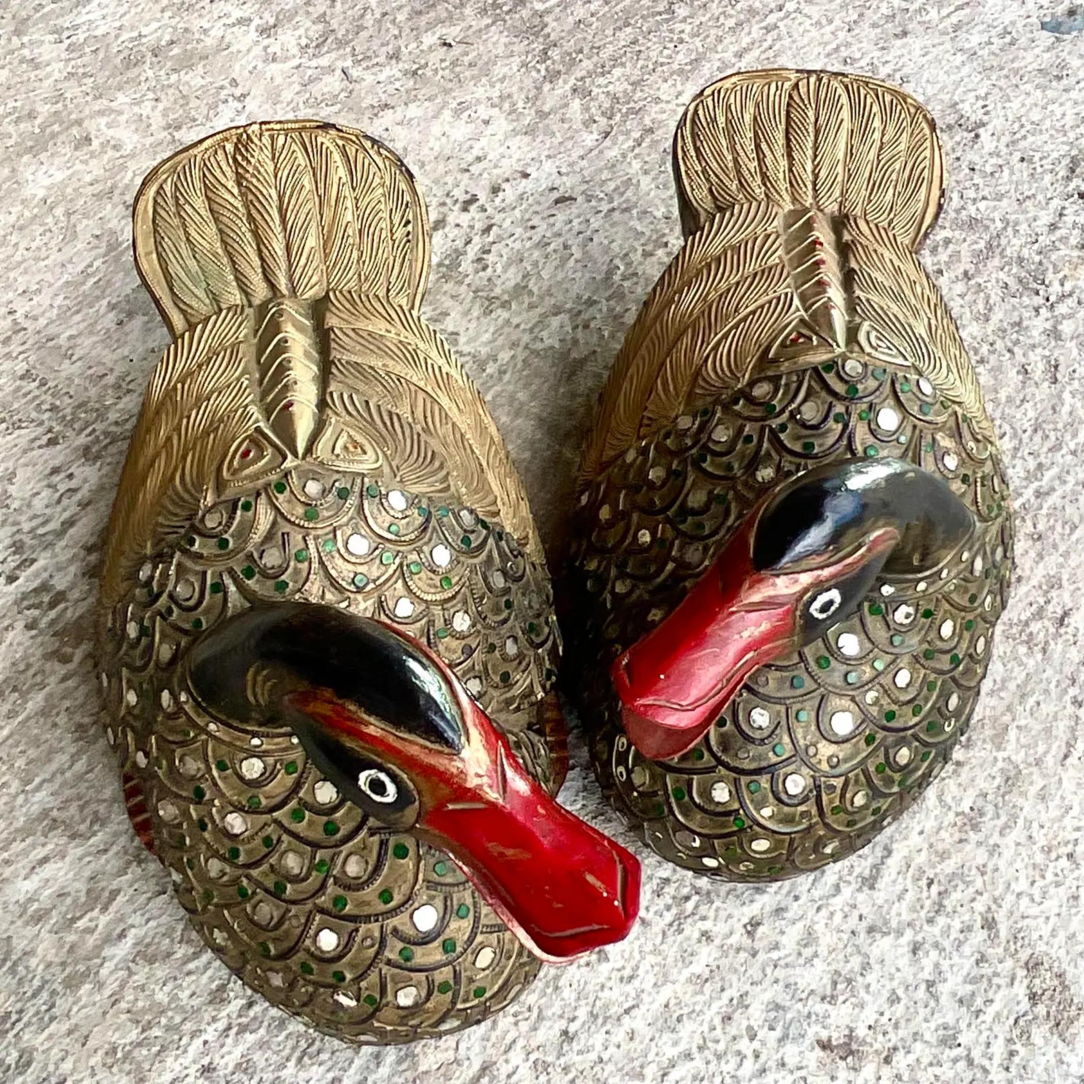 A fabulous pair of vintage Boho ducks. Chic hand carved detail with beautiful gilt detail. Little sparkling touches among the feathers. Acquired from a Palm Beach estate