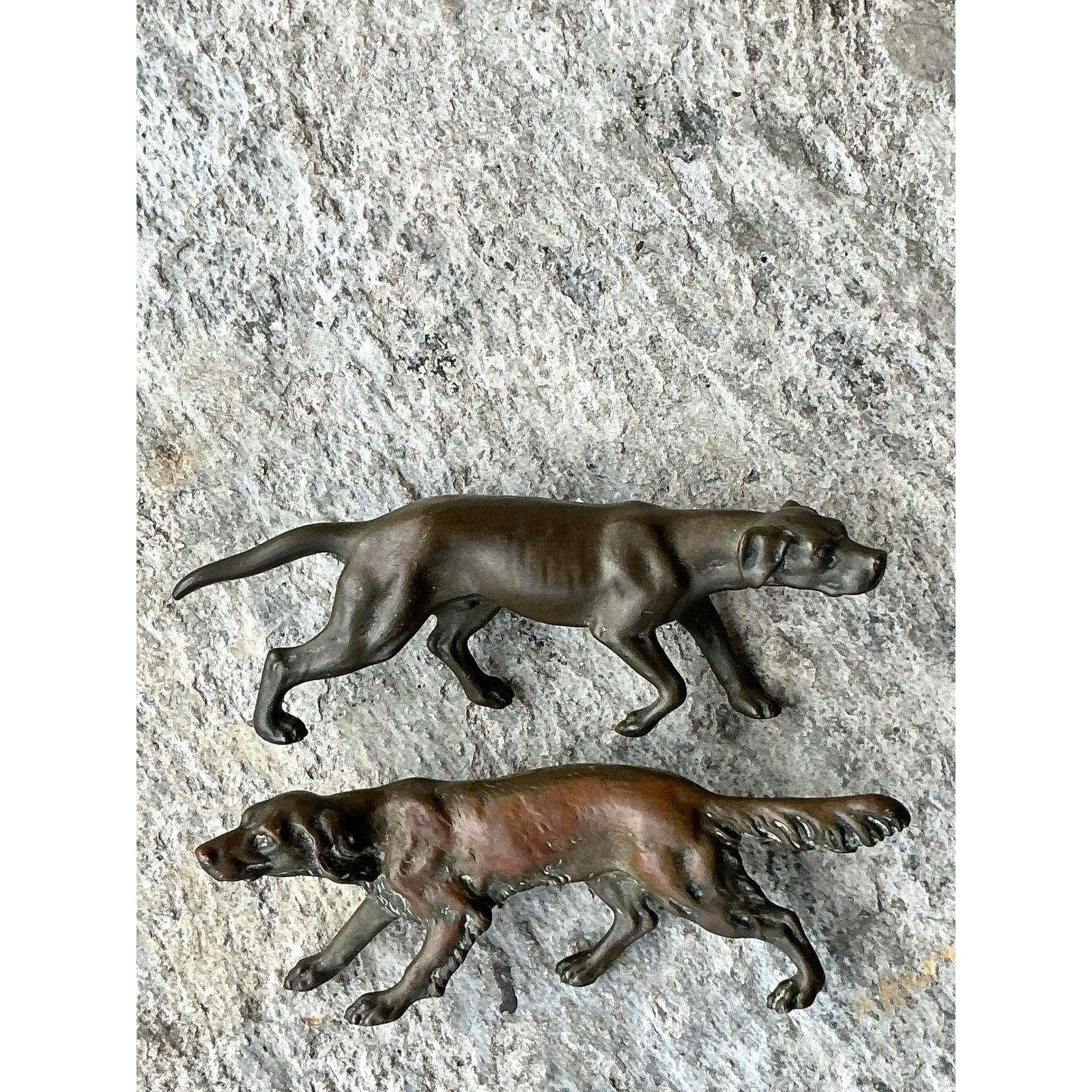 Bring whimsical charm and vintage character to your furniture with this set of two cast metal dog drawer pulls, perfect for the animal lover or eclectic decorator. Each pull showcases a beautifully sculpted dog in motion, cast with fine detail and a