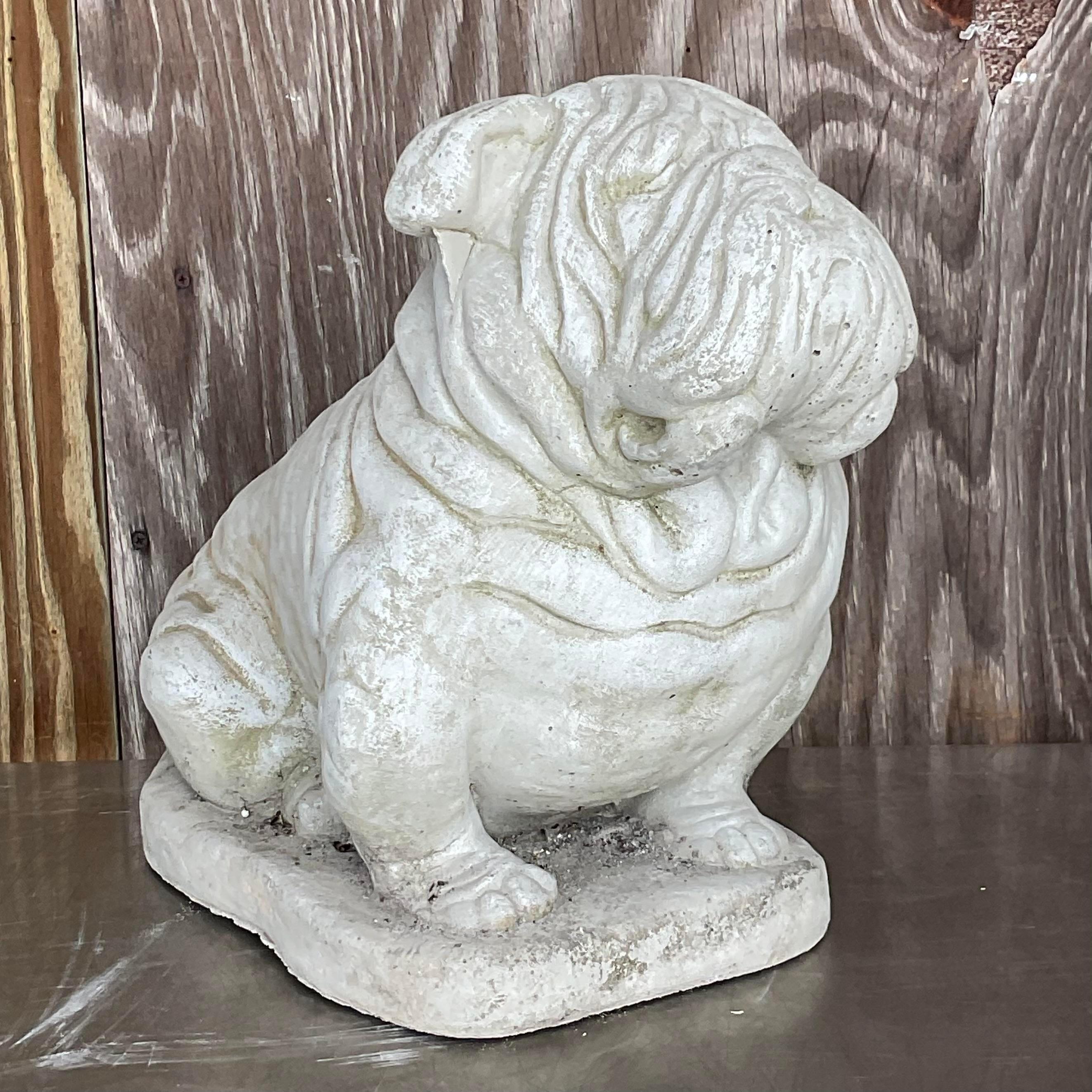 Add whimsy to your décor with our Vintage Boho Cast Cement Bulldog. American-crafted and full of character, this bulldog statue captures boho charm in durable cement, making it a playful and enduring accent for any space.