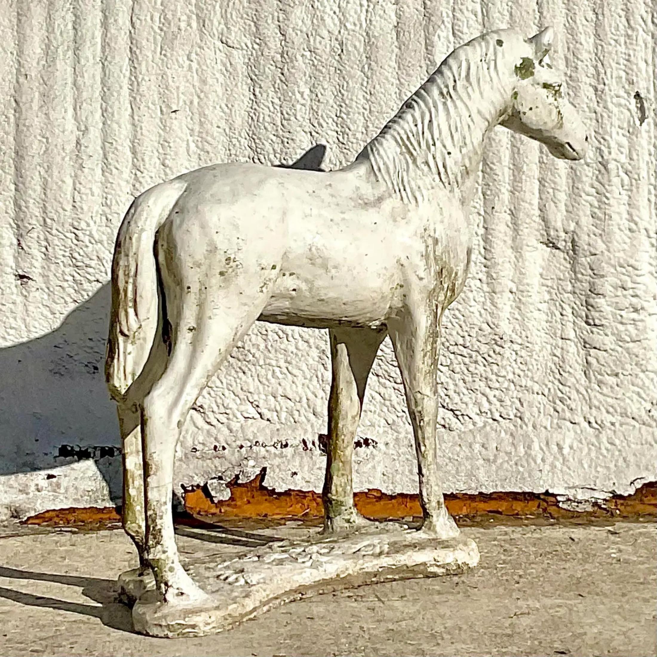 A fantastic vintage Boho horse statue. Large in size and drama. Cast concrete with incredible attention to detail. Acquired from a Palm Beach estate.