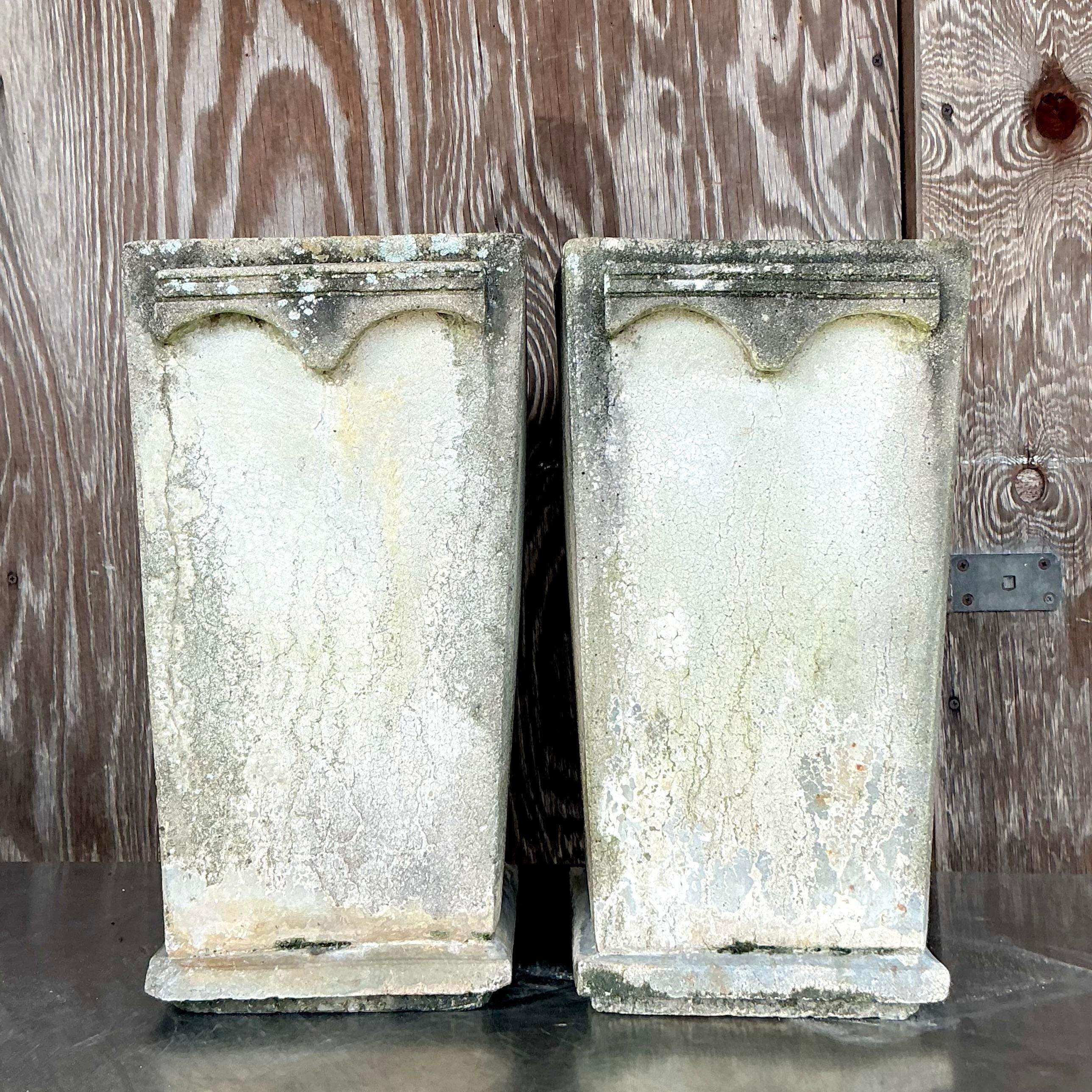 Bring bold boho vibes to your garden or home with this pair of Vintage Cast Concrete Arches Planters. Featuring striking arched designs, these sturdy planters offer a perfect blend of bohemian artistry and modern minimalism. Ideal for showcasing