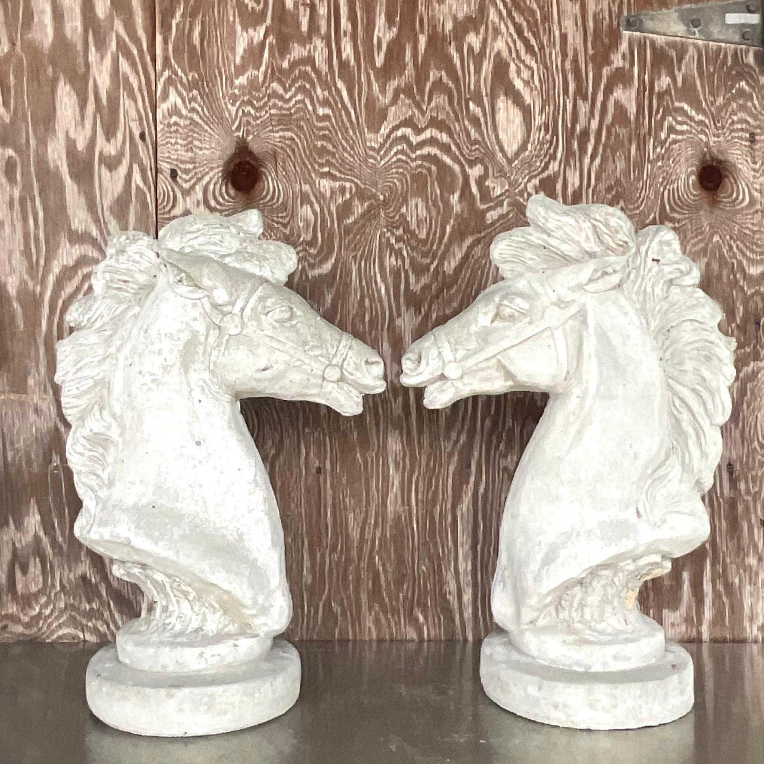 A fabulous pair of vintage Boho horse heads. Chic cast concrete with a dramatic horse pose perfect indoors or outdoors. You decide! Acquired from a Palm Beach estate.