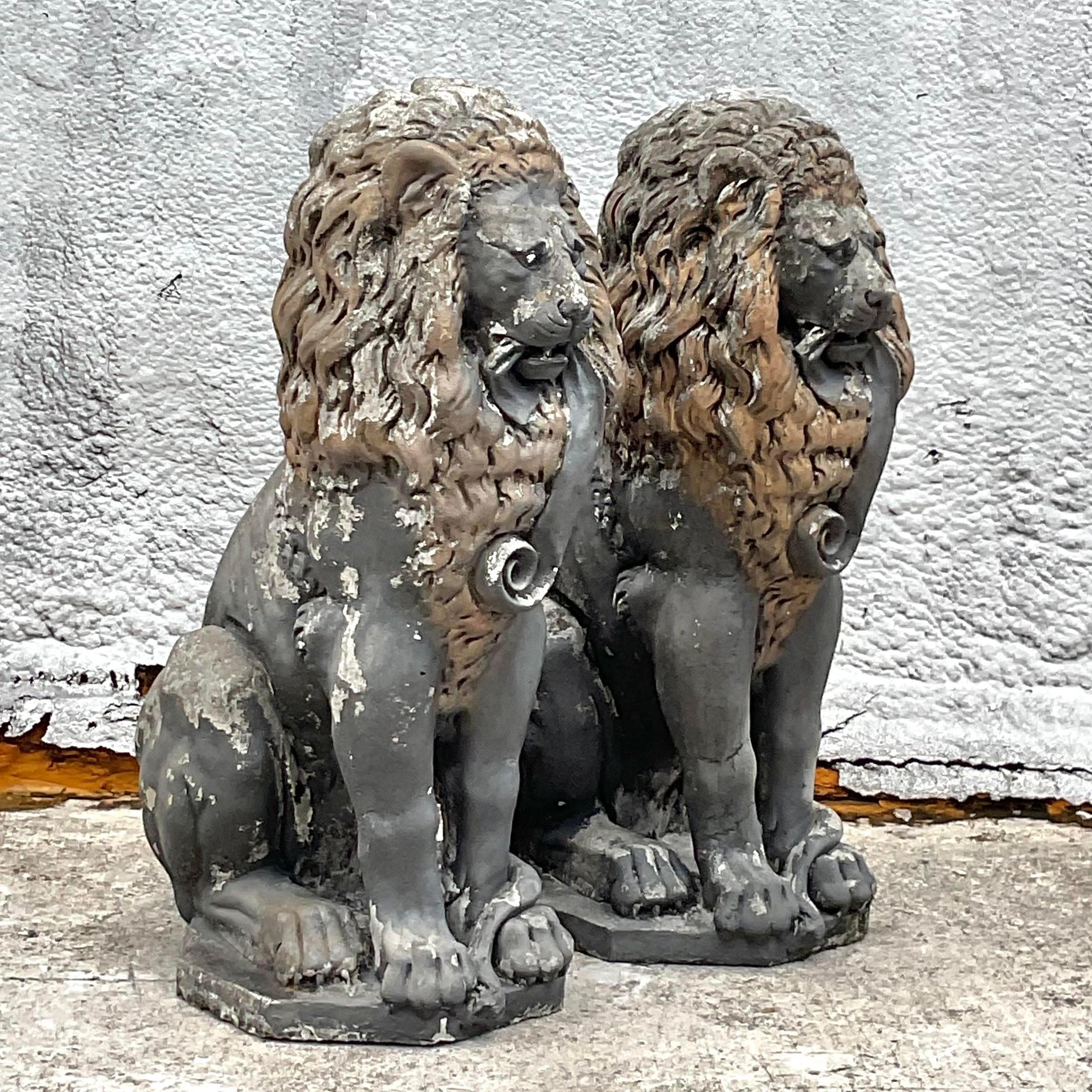 Elevate your outdoor décor with our Vintage Boho Cast Concrete Lion Statues - A Pair. Crafted in the USA, these statues embody American craftsmanship and bohemian charm, adding a touch of regal elegance to your garden or patio.