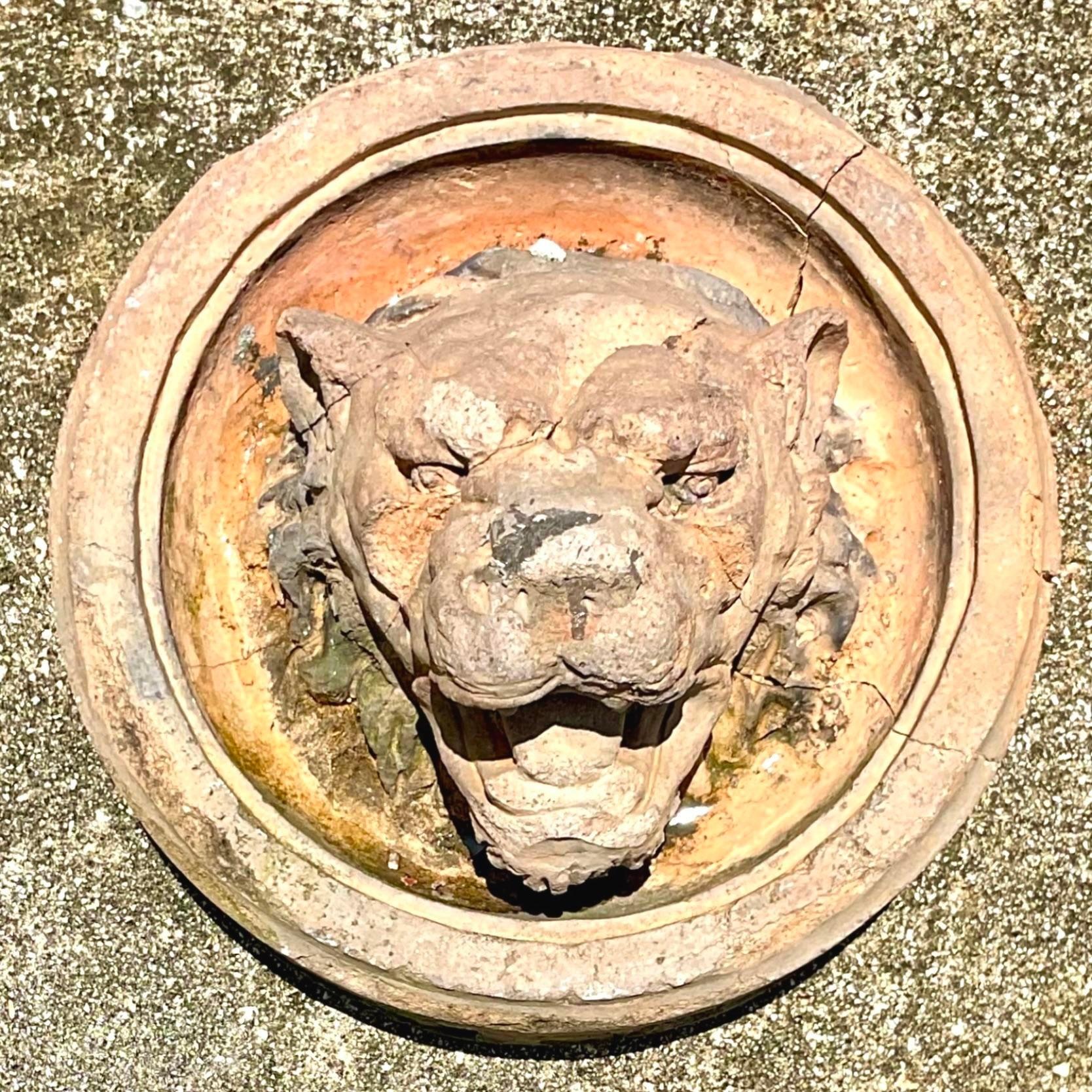A stunning vintage Boho cast concrete medallion. A handsome lion’s head with incredible patina from time. Perfect for your garden or make a bold statement on your mantle. You decide! Acquired from a Palm Beach estate.