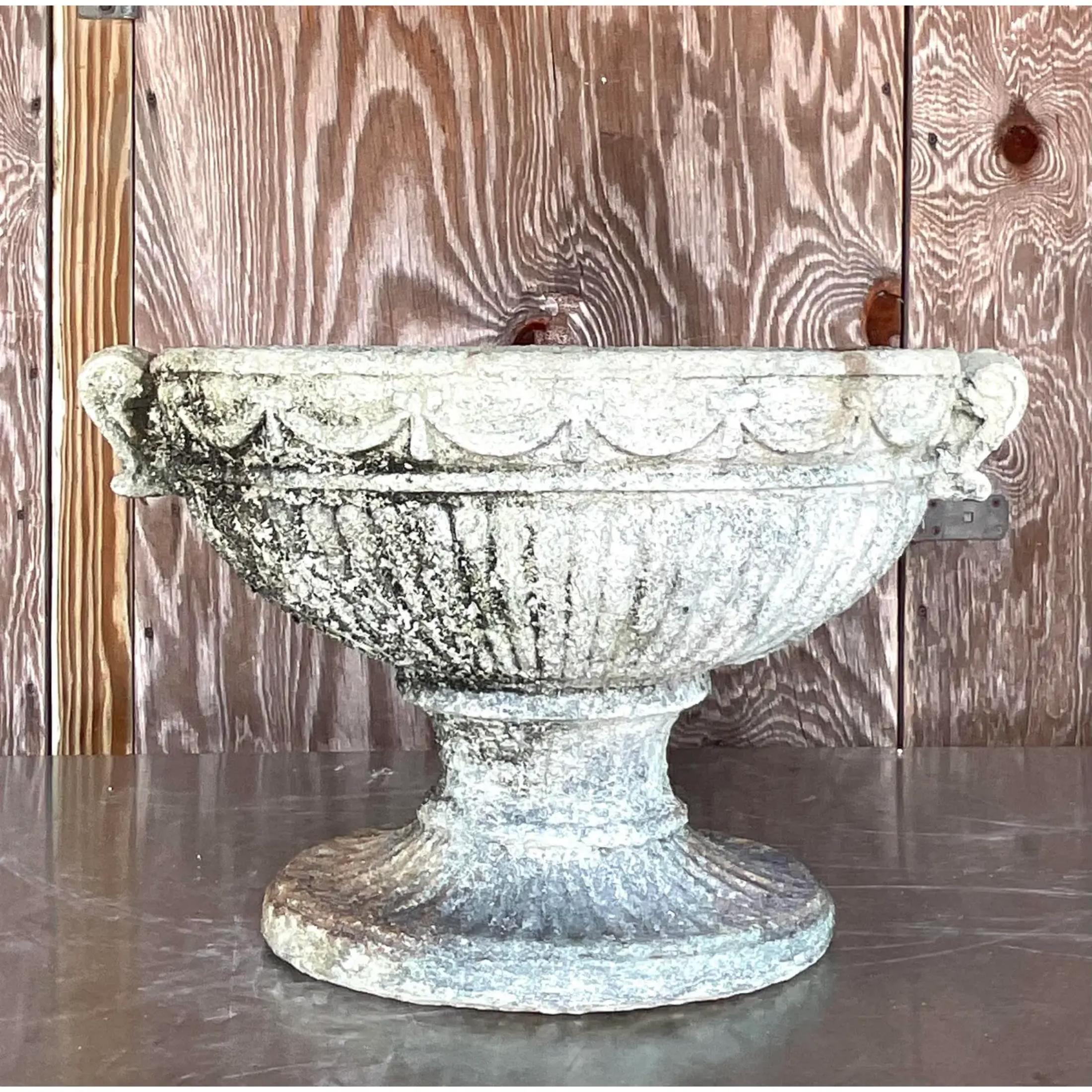 A fabulous vintage cast concrete planter. Beautiful swag design with lots of great patina from time. Beautiful indoors or outside. No hole for drainage. Acquired from a Palm Beach estate
