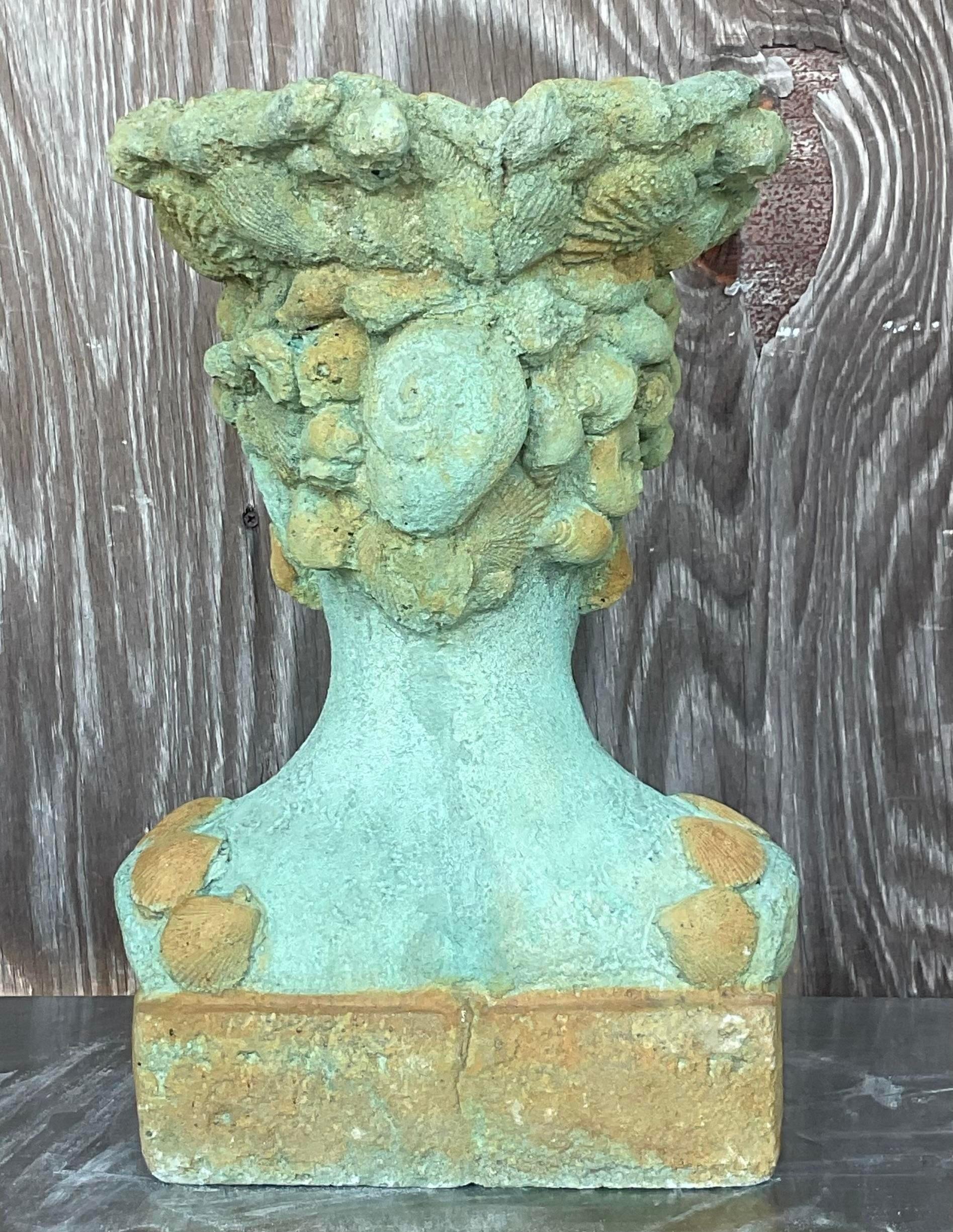 Seaside Serenity: Channel coastal vibes with this Vintage Boho Cast Concrete Woman In Shells Planter. A unique fusion of artistry and functionality, it brings a touch of the ocean's beauty to your home, American style