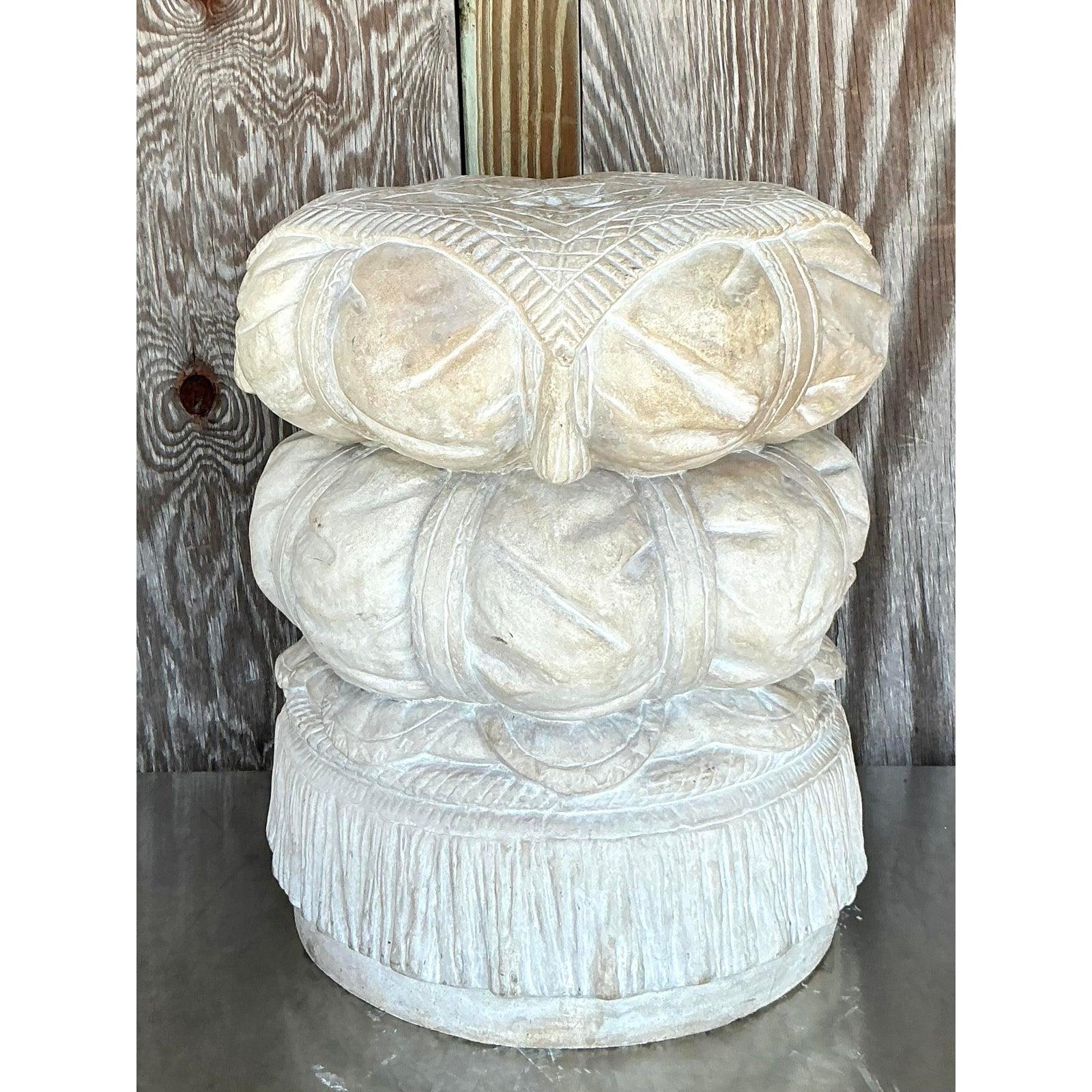 Infuse your space with a touch of whimsical glamour with this exceptional vintage cast plaster stool. Masterfully designed to resemble a luxurious, stacked tassel or pillow, this piece is a testament to sculptural craftsmanship. The intricate