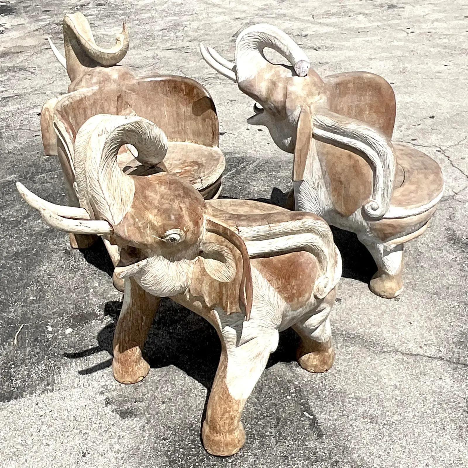 A spectacular vintage Boho lounge chair. A beautiful hand carved elephant with a chic cerused finish. Incredible attention to detail. Three chairs available. Acquired from a Palm Beach estate.
