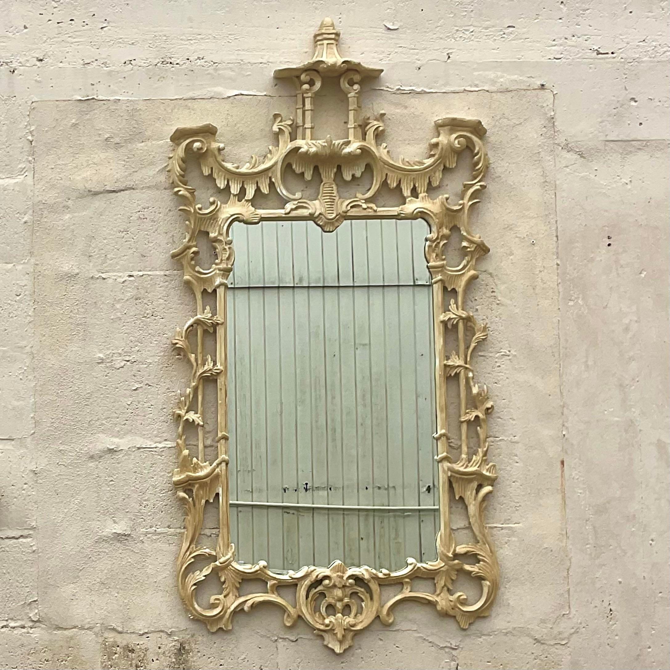 A fabulous vintage Regency Pagoda mirror. Beautiful hand carved wood detail in a cerused finish. Gorgeous Pagoda roofline on top. Acquired from a Palm Beach estate.
