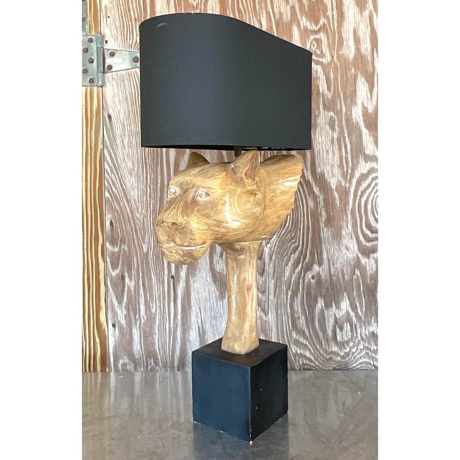 A striking vintage Boho table lamp. A gorgeous cerused finish on wood with a coordinating black linen shade. A handsome winged lions head. Acquired from a palm Beach estate.