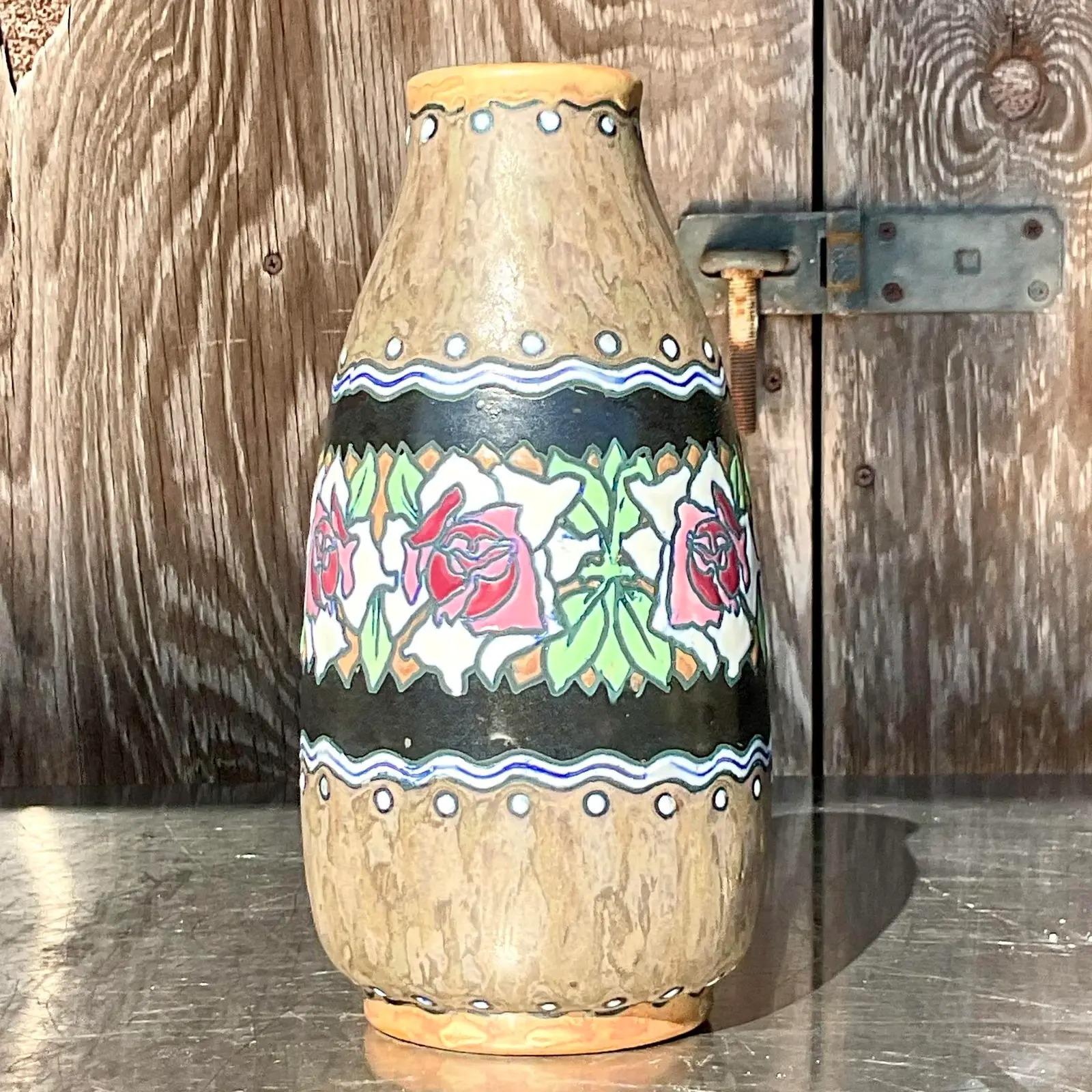 A stunning vintage Boho hand painted vase. Made by the coveted Charles Gatteau for Bock Freres Keramis. Beautiful floral ring on a beau trail background. Signed on the bottom. Acquired from a Palm Beach estate.