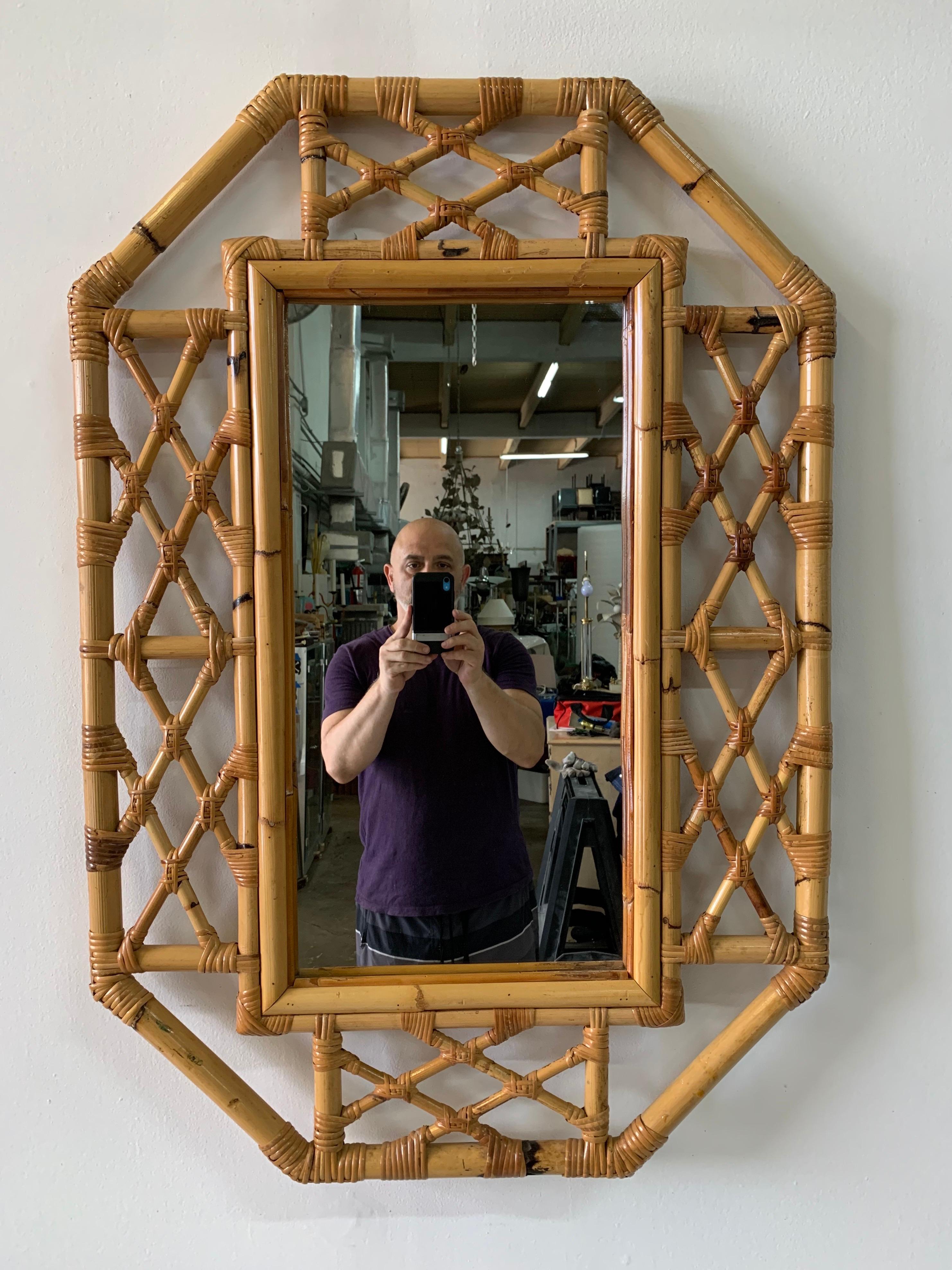 This vintage bamboo Chippendale or Bohemian styled accent mirror in octagonal shape, is sturdy and very well constructed; Chic and very desirable!