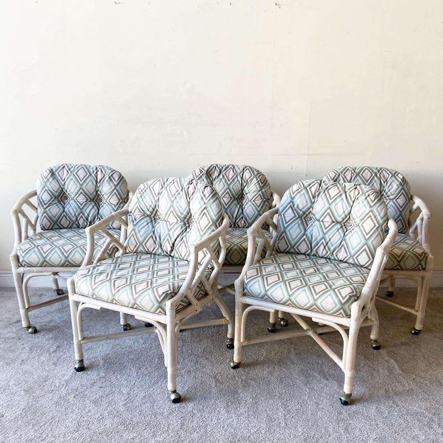 Amazing set of 5 boho chic bamboo rattan chairs by Henry Link. Features a wonderful chippendale frame with upholstered cushions.

Seat height is 19.0 in