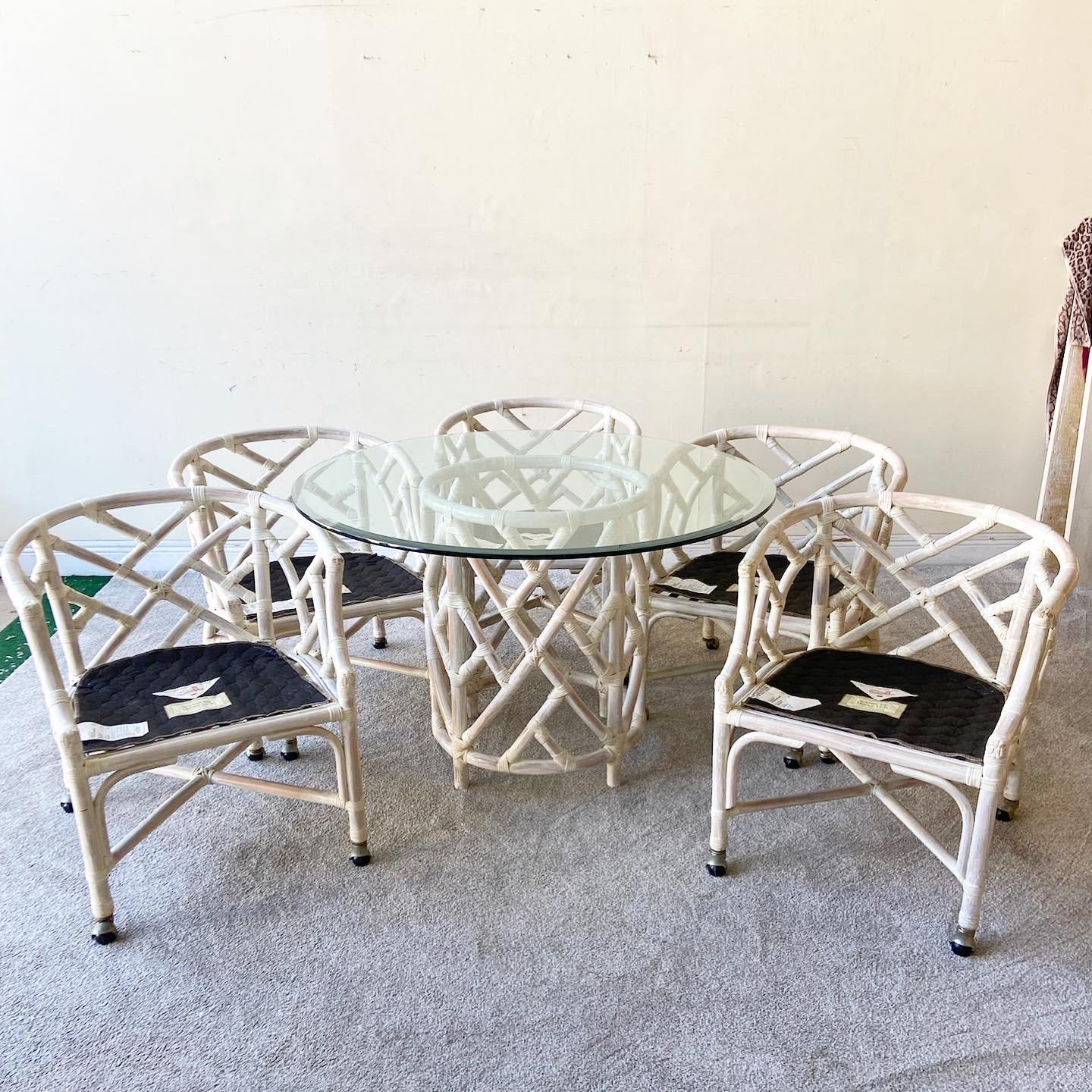 Amazing vintage boho chic circular glass top dining table by Henry Link. Features a fantastic bamboo rattan chippendale pedestal base.

Table measures 44”W, 44”D, 28.5”