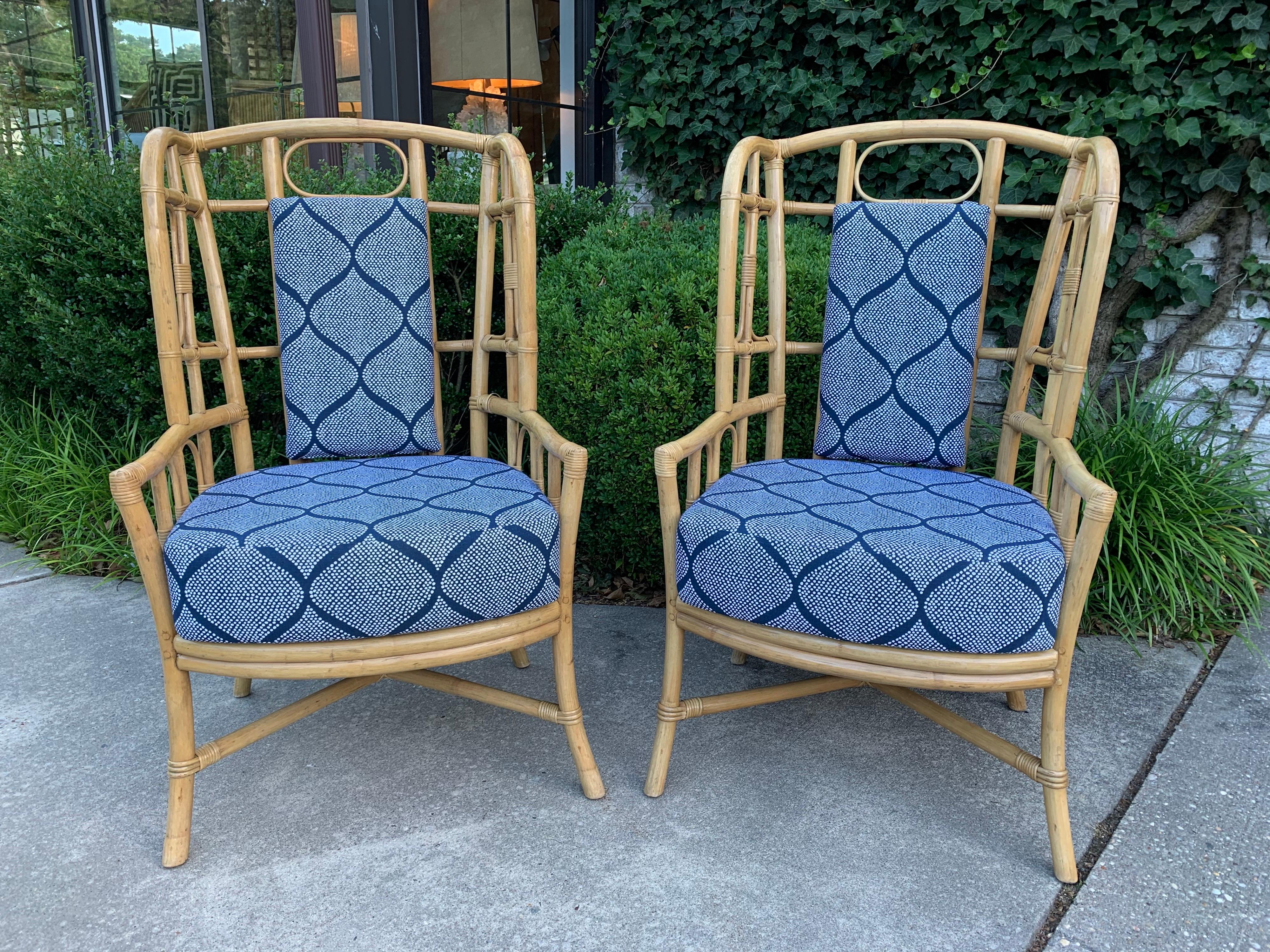 These boho chic bamboo flared wing armchairs with graphic oval design to back. Newly reupholstered in Sunbrella fabric. Back cushion is removable if desired with Velcro straps. Very Caribbean and solid framed chairs.

Measures: Seat height is 20