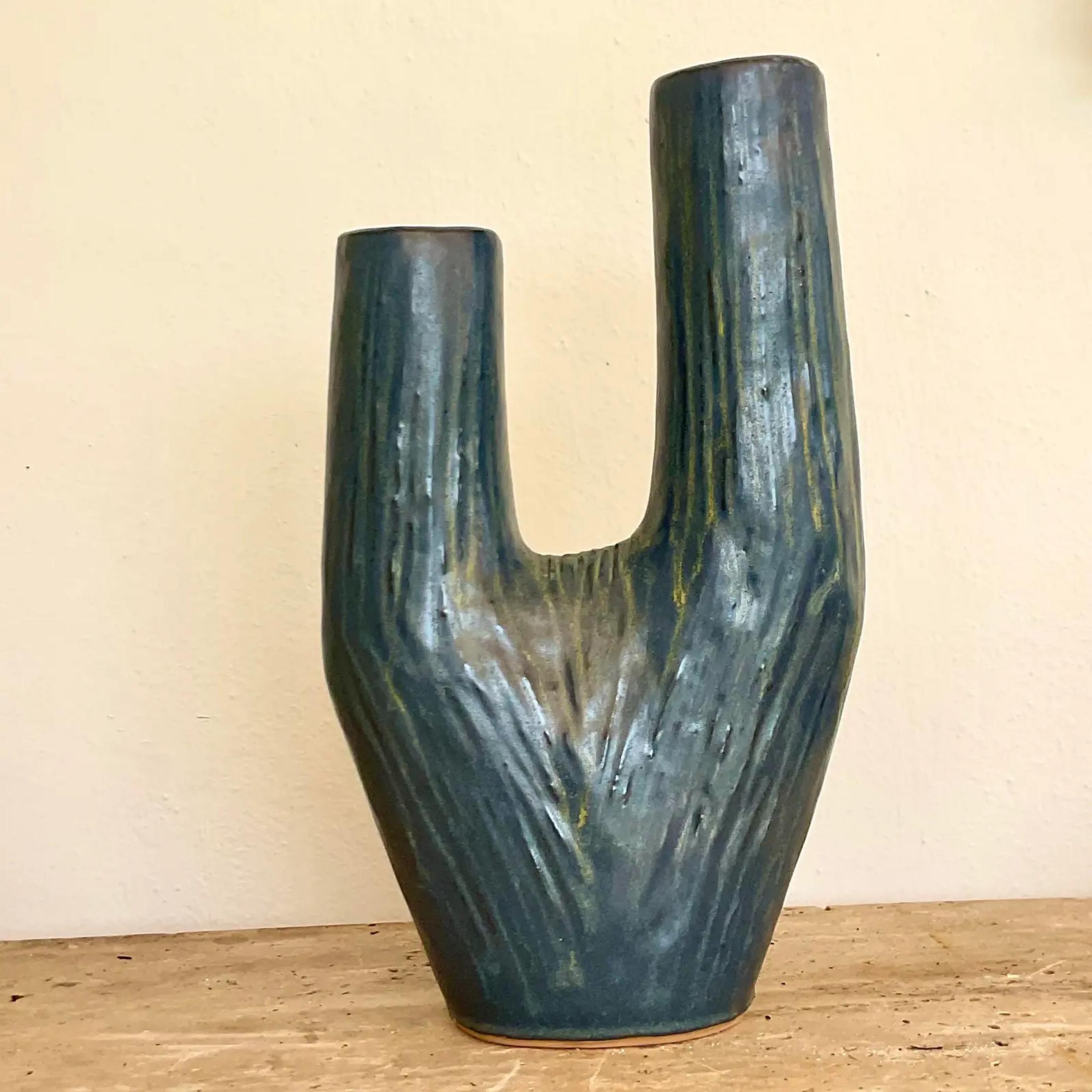 A fabulous ceramic table vase in a unique shade or grey-blue that could hold your favorite flowers. Acquired at a Palm Beach Estate