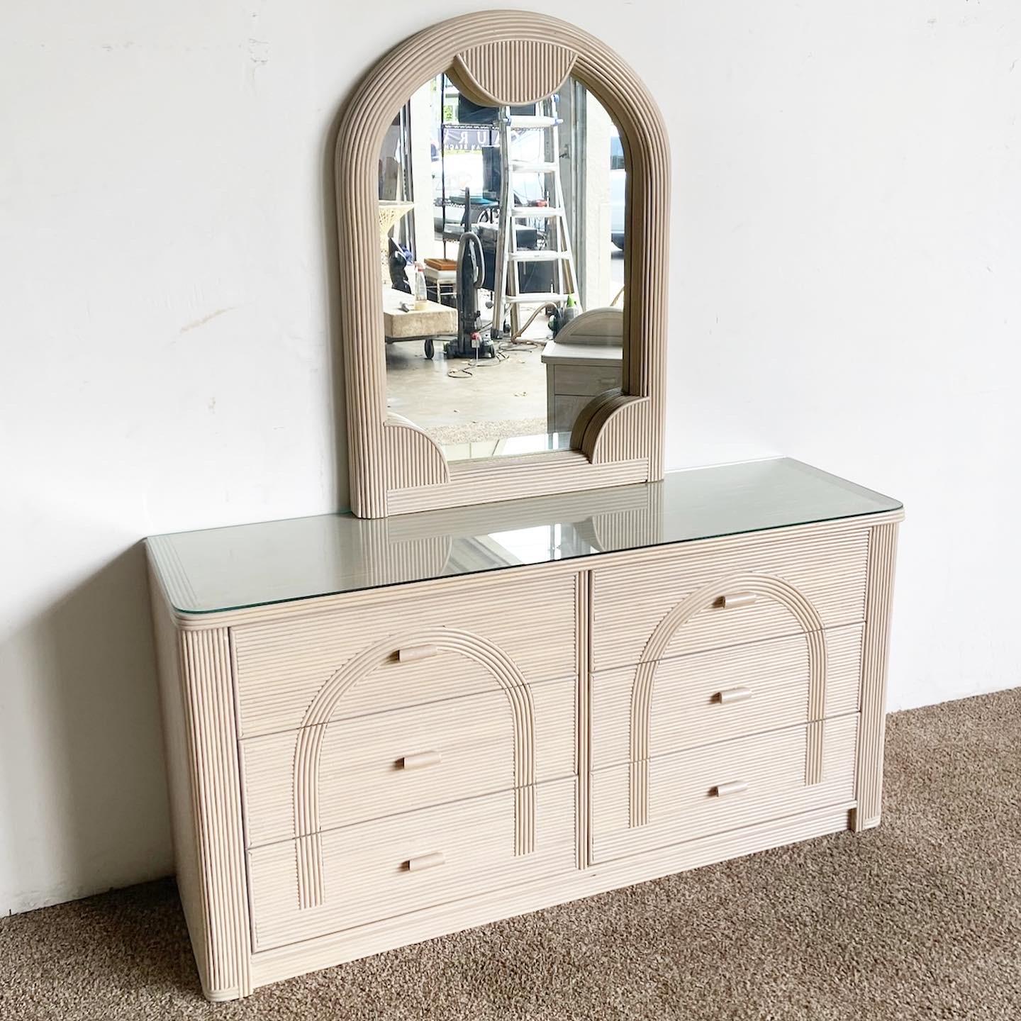 Enhance your bedroom with this magical vintage Boho Chic Dresser and Mirror set, boasting intricate Pencil Reed detailing. The mirror measures 29”W x 2.5”D x 39.25”H, offering a generous reflection space.

Dresser and mirror set featuring a vintage