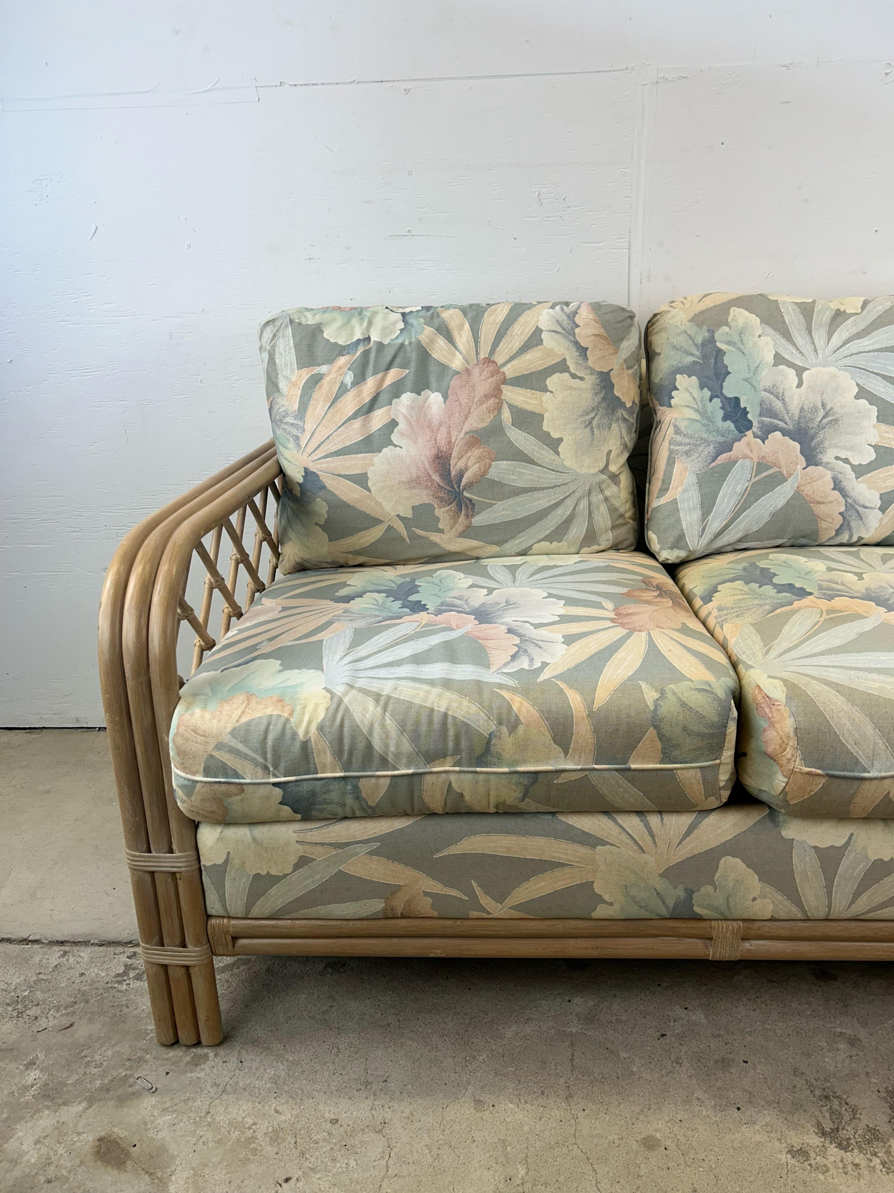 Vintage Boho Chic Rattan Loveseat with Floral Upholstery In Good Condition For Sale In Freehold, NJ