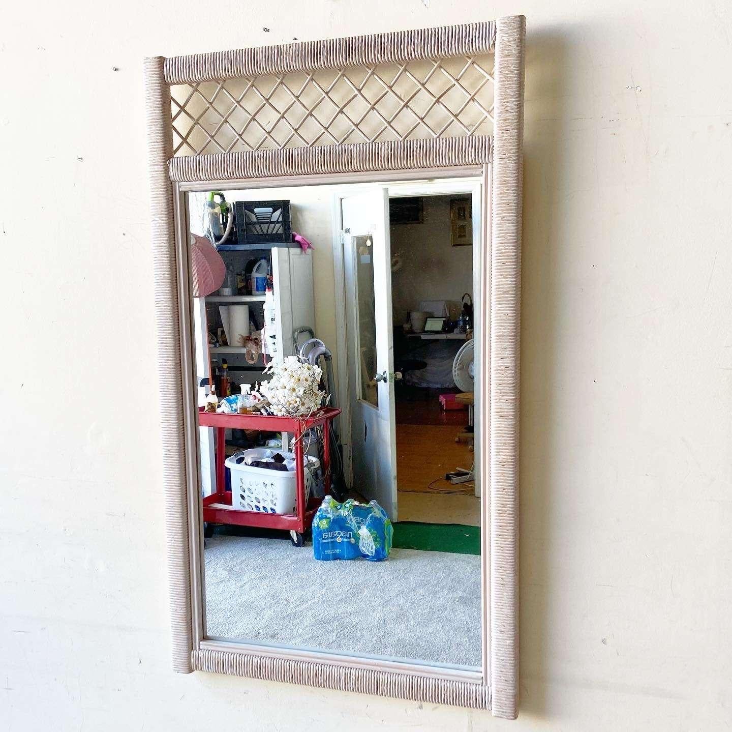 Amazing vintage bohemian mirror by Henry Link. Features a wicker and rattan frame.