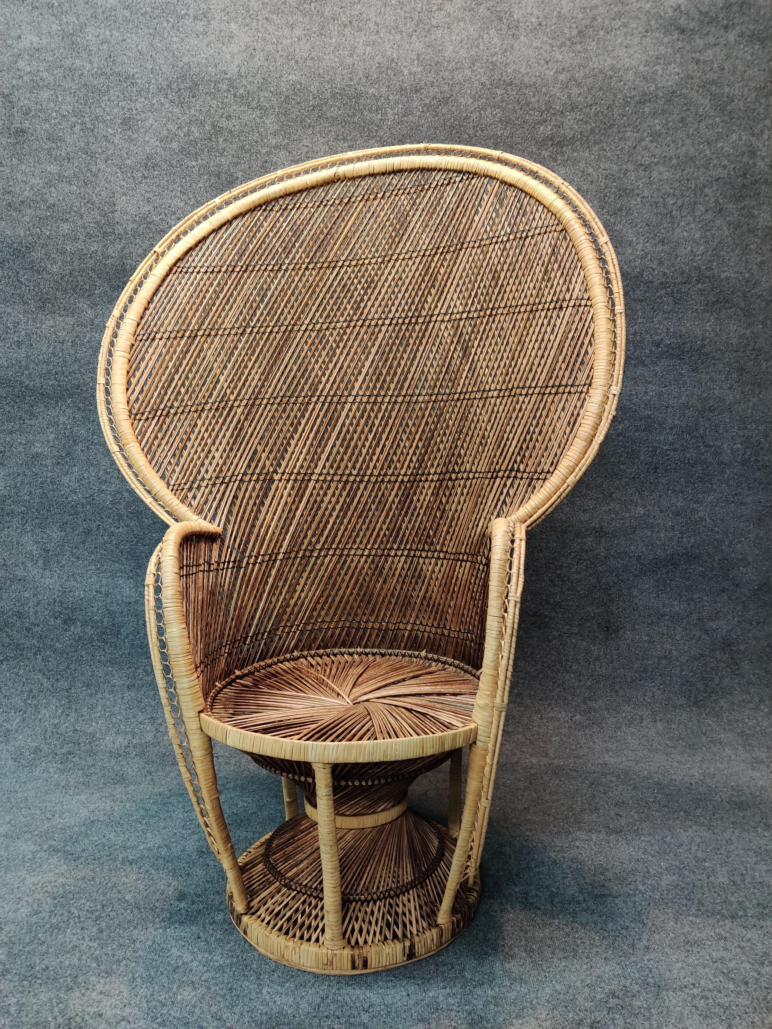 Bohemian chic stylish handcrafted tall and elaborate peackock chair from the 1960s. Sturdy and comfortable for everyday use. Few breaks or losses observed. Minor oxidation to material. Very good vintage condition.