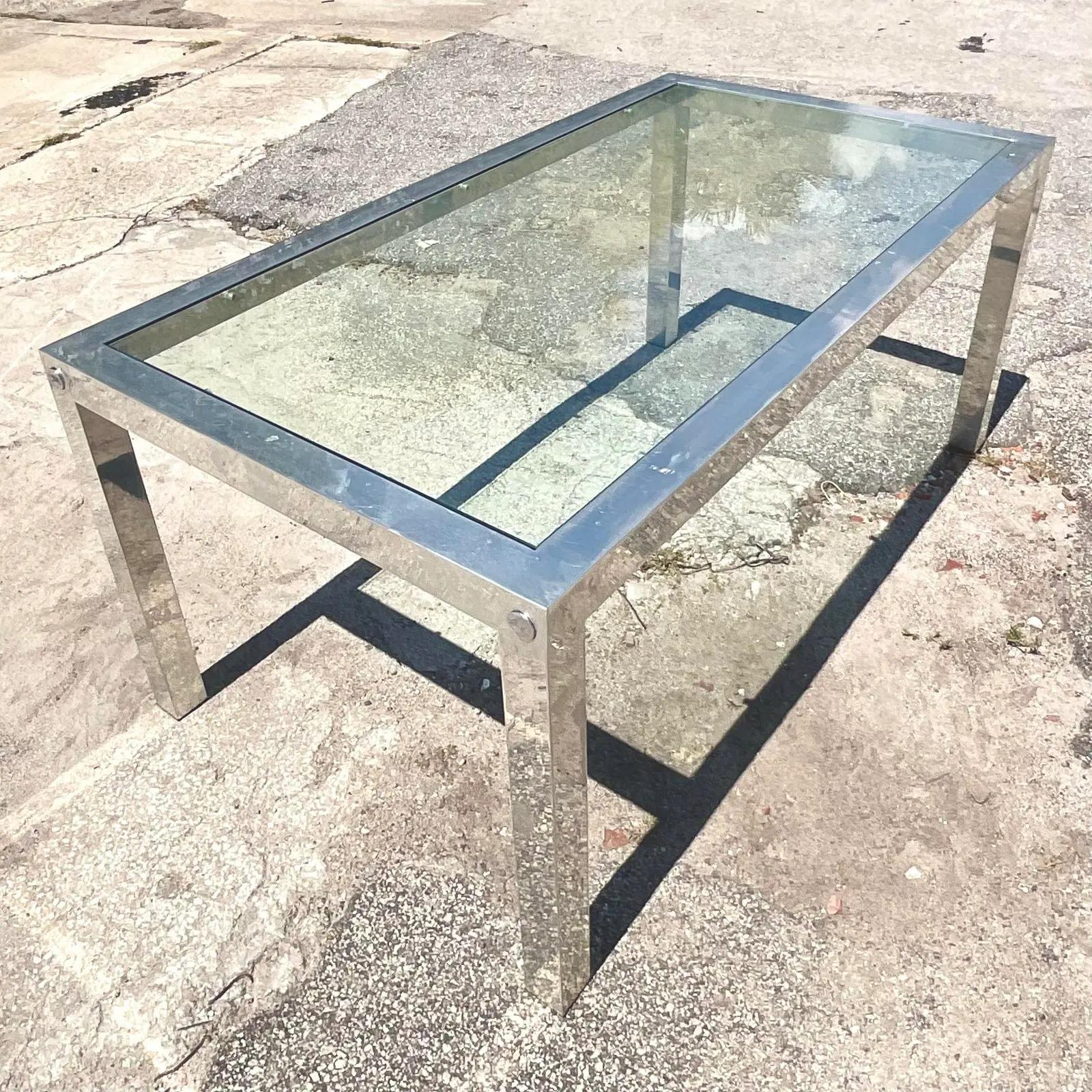 Fabulous vintage Boho dining table. Beautiful chrome frame with an inset glass panel. Chic and simple in its design. Acquired from a Palm Beach estate.