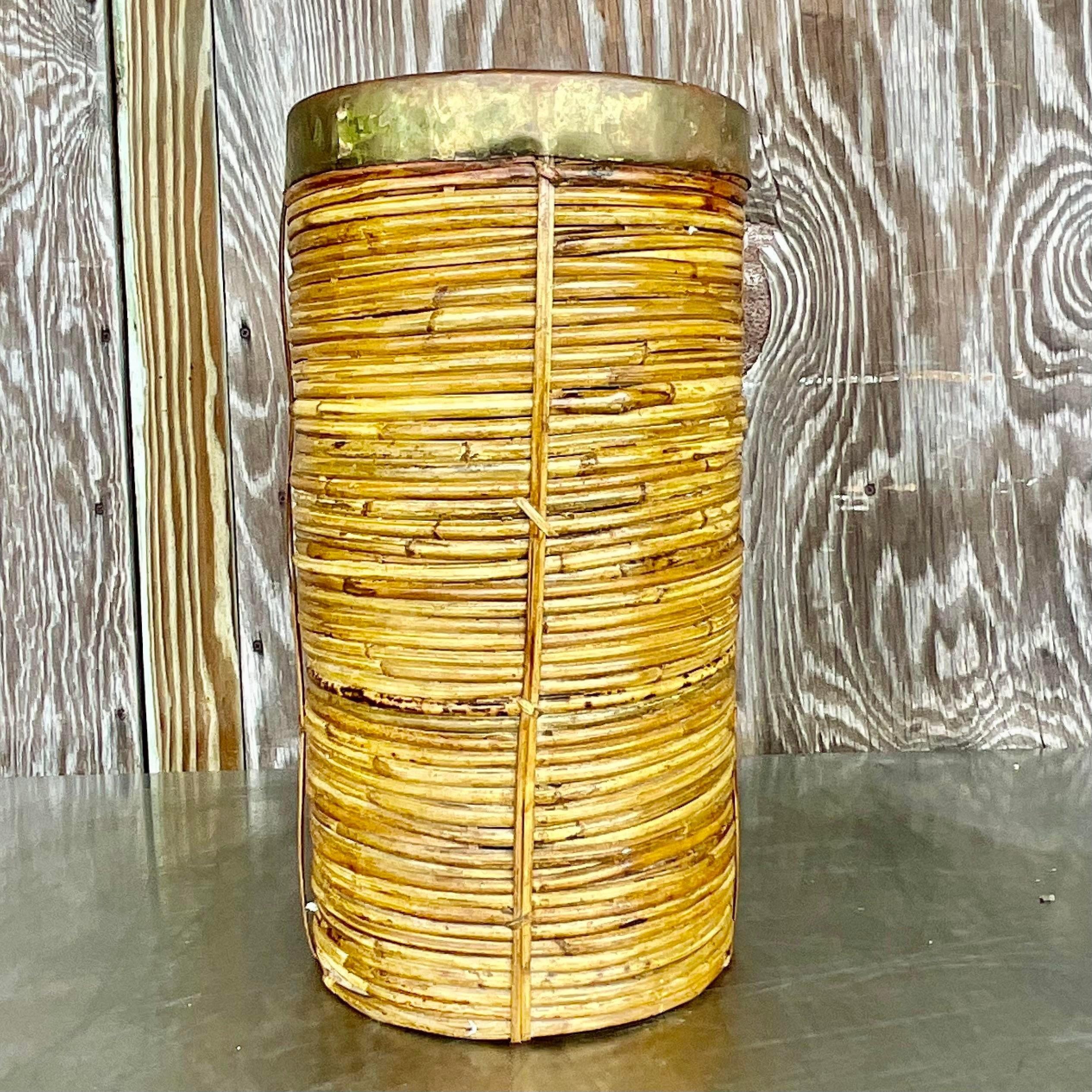 Infuse your entryway with eclectic charm using the Vintage Boho Coiled Pencil Reed Umbrella Stand, a fusion of bohemian flair and classic utility. Handcrafted with natural materials, it effortlessly combines form and function to elevate your home