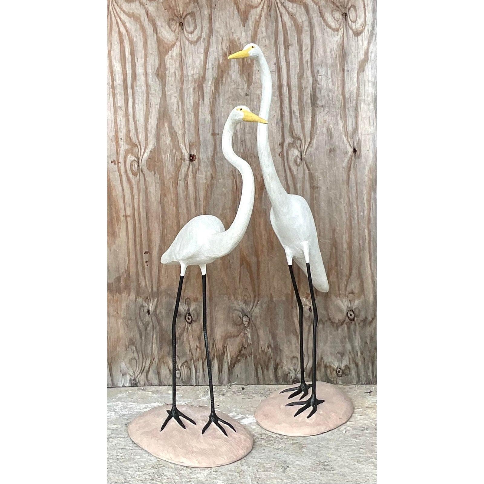 A handsome pair of vintage Coastal cranes. Beautifully hand painting on a concrete construction. Perfect indoors or outside. You decide! Acquired from a Palm Beach estate.

Lower crane 27x12x37 