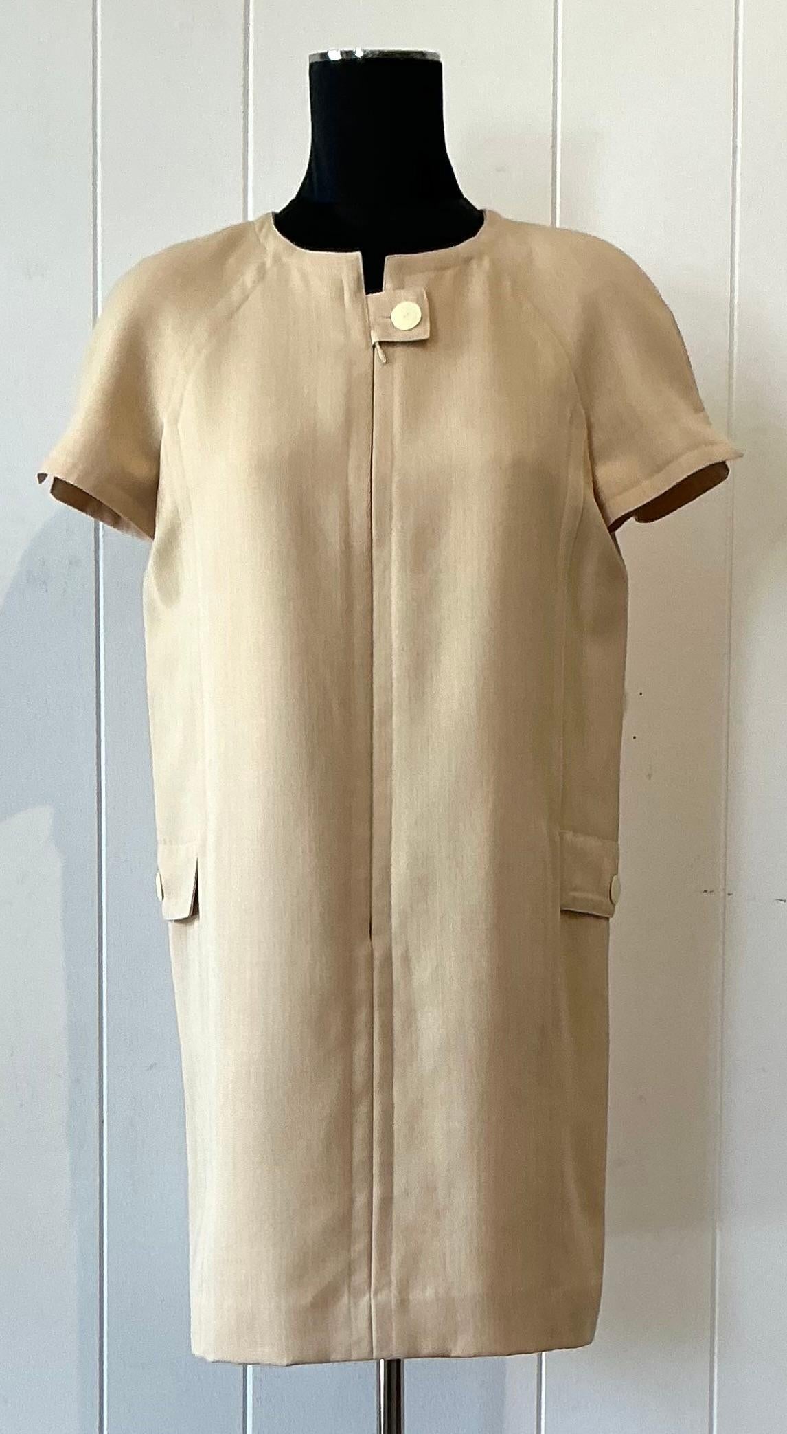 This vintage boho Courrèges short sleeve dress is a rare fusion of mod minimalism and free-spirited elegance, perfectly capturing the brand’s futuristic yet feminine aesthetic. Crafted from a lightweight, breathable fabric, the dress features a