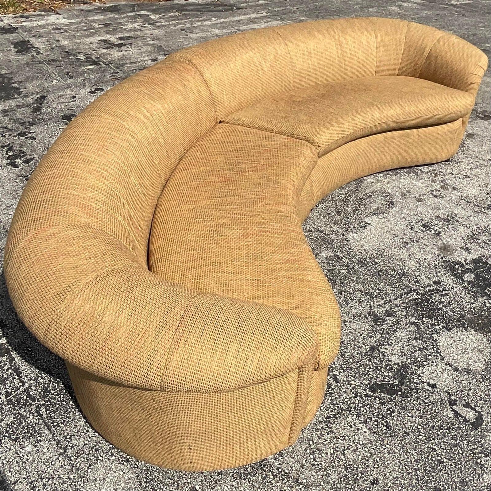 A fantastic vintage boho sectional sofa. Beautiful roll back and recently reupholstered. Acquired from a Palm Beach estate.

Each section is 63.5.