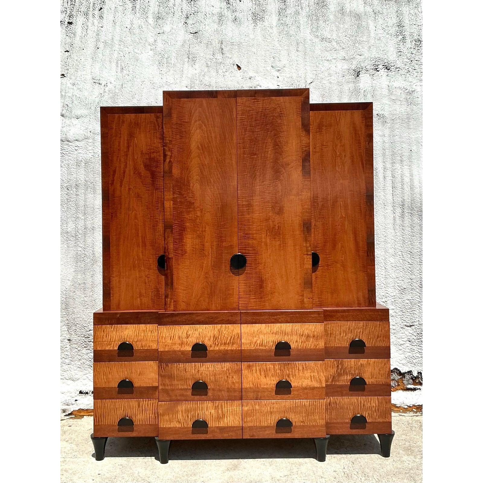 Command attention and infuse your space with unparalleled character with this magnificent vintage custom burl cabinet. A spectacular display of woodworking artistry, this piece showcases a breathtaking combination of richly figured veneers on its
