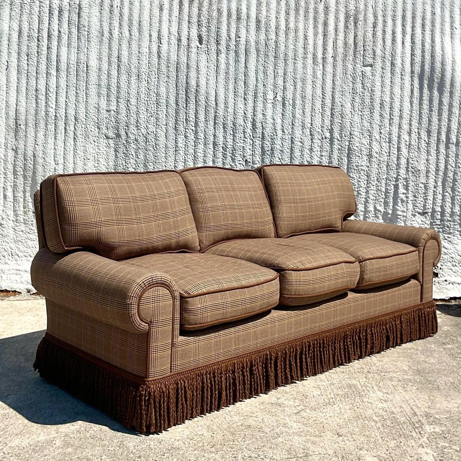 An exceptional vintage custom built sofa. Beautiful wool Glencheck plaid in, rich browns. Totally down filled with gorgeous twisted brown fringe. Perfect in every way. Acquired from a Palm Beach estate.