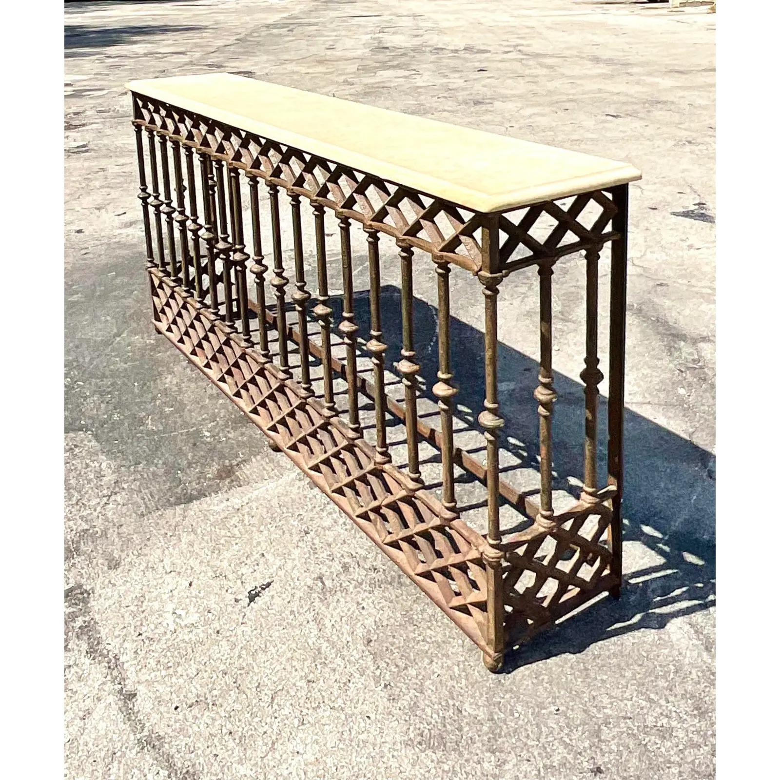 Vintage Boho custom built Wrought iron console table. Beautiful beautiful stone top with a bull nose edge. Base my from fragments of gates brought back from Paris. Tall and impressive. Acquired from a Palm Beach estate.