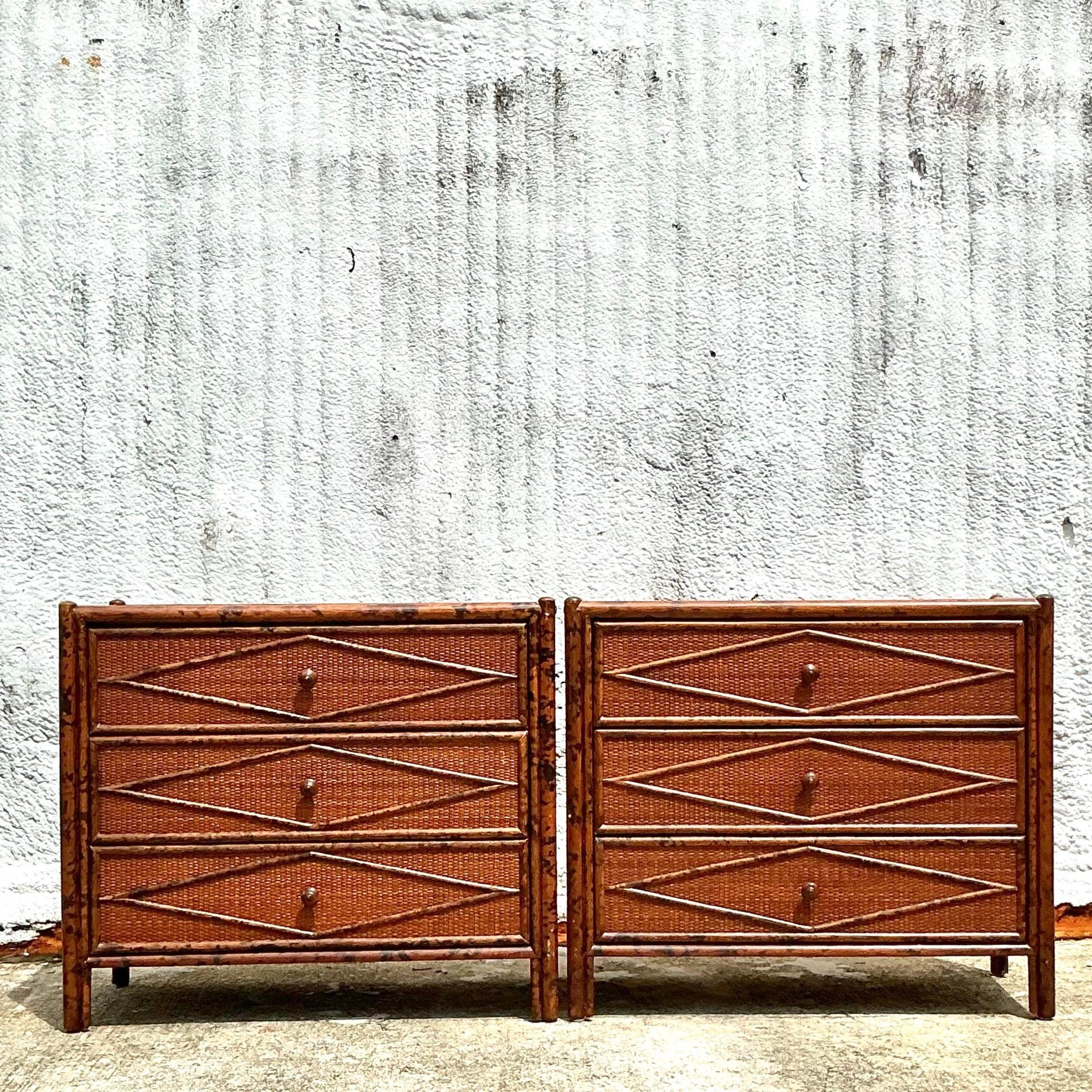A stunning pair of Vintage Boho burnt bamboo chests with diamond-patterned fronts. These unique pieces blend natural texture with bohemian style, adding a chic, earthy vibe to your space. Acquired from a Miami estate.