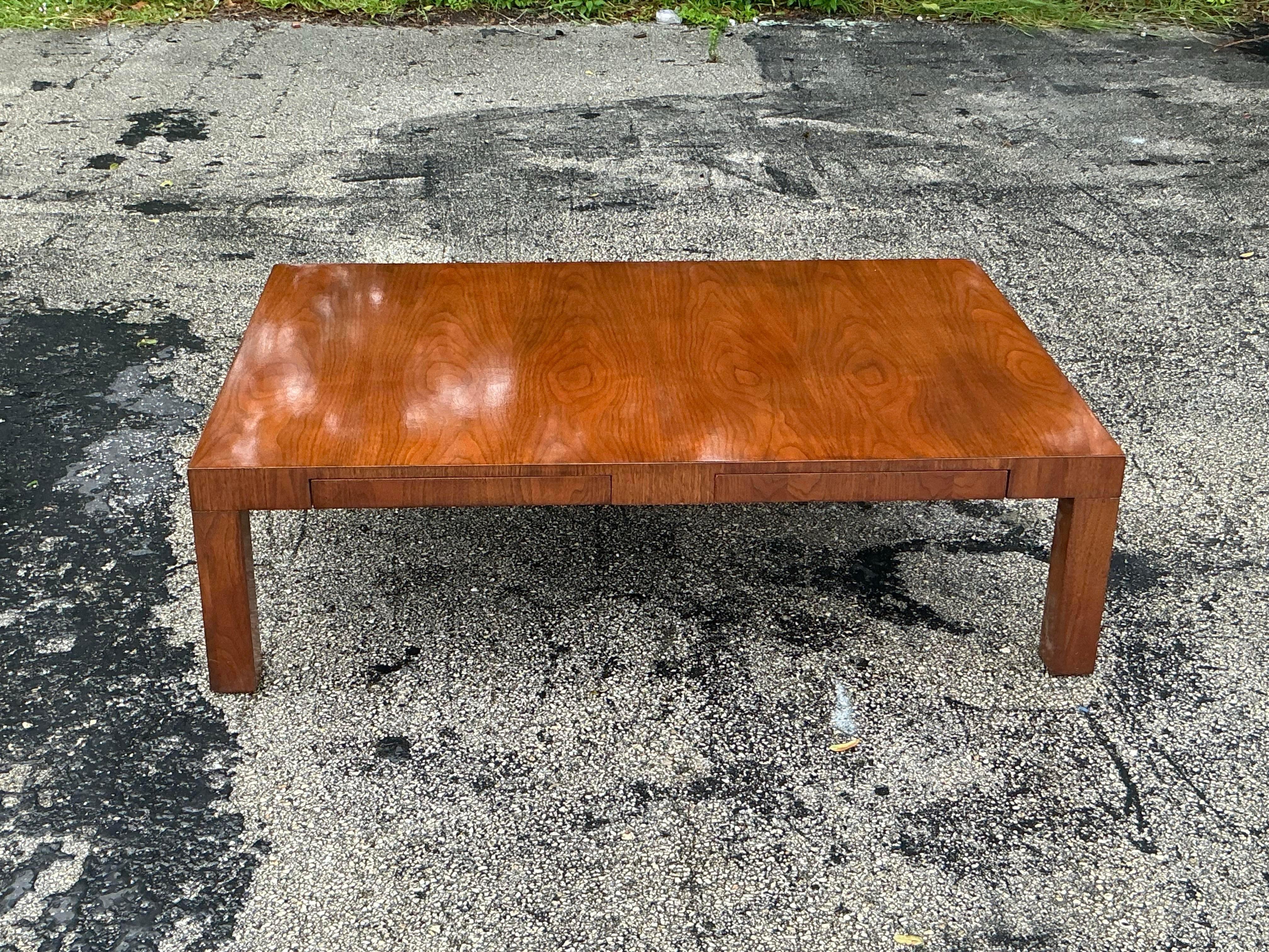 Elevate your living space with the distinctive charm of this Vintage Boho Directional Four Drawer Coffee Table. Featuring a sleek, low-profile design, this coffee table combines bohemian flair with functional storage. Crafted with a unique