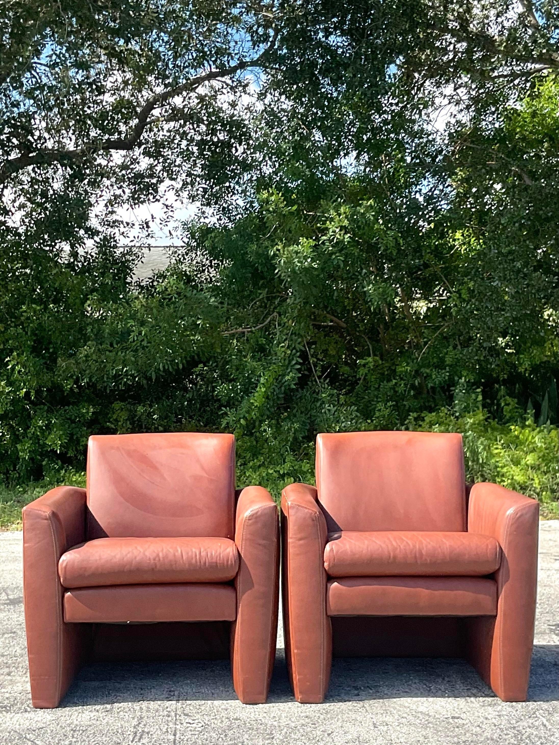 An exceptional pair of vintage Boho Club chairs. Made by the iconic Directional group and tagged below the seat. Incredible Cognac leather on a clean and modern shape. Two pairs available on my page. Acquired from a Palm Beach estate.