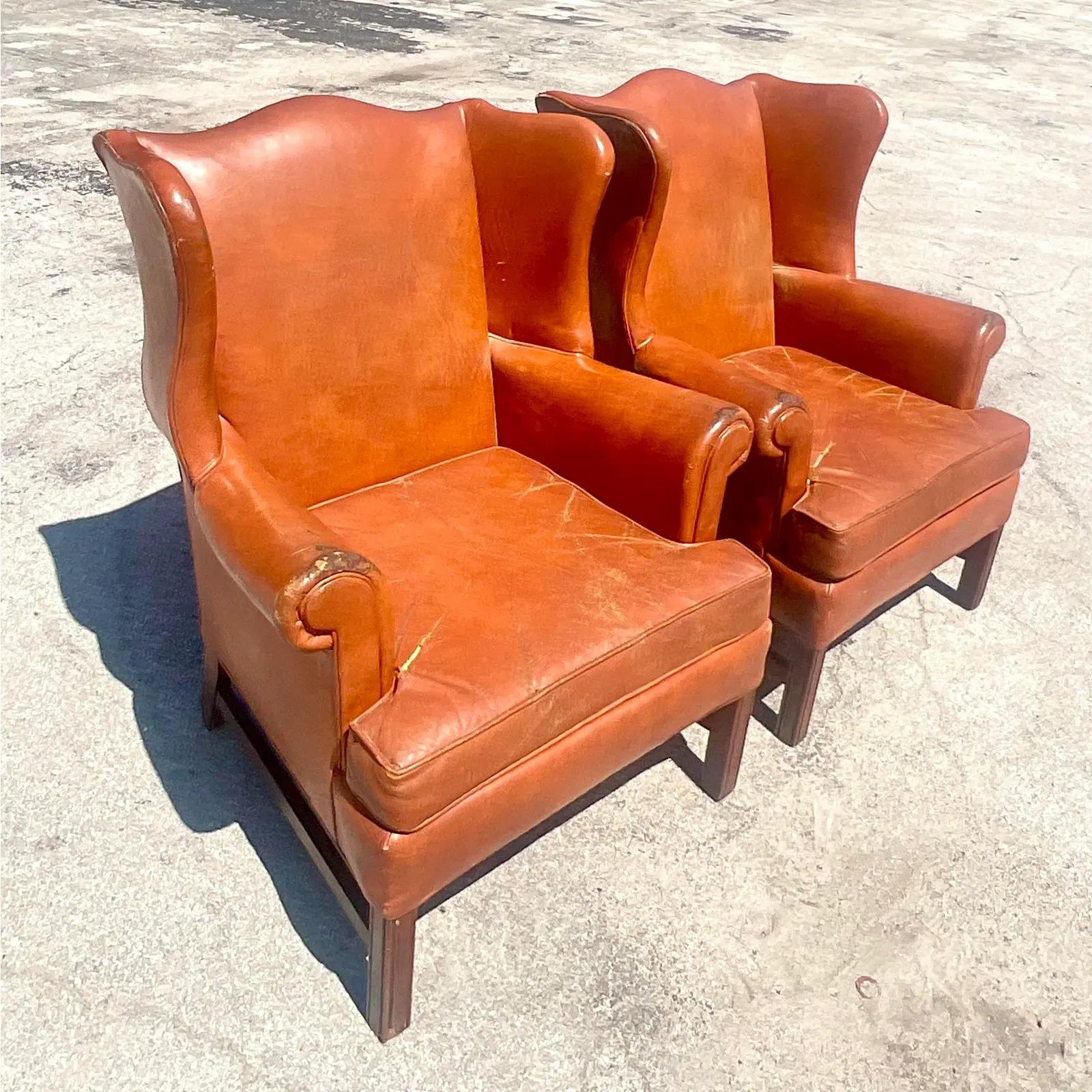 North American Vintage Boho Distressed Leather Wingback Chairs, a Pair
