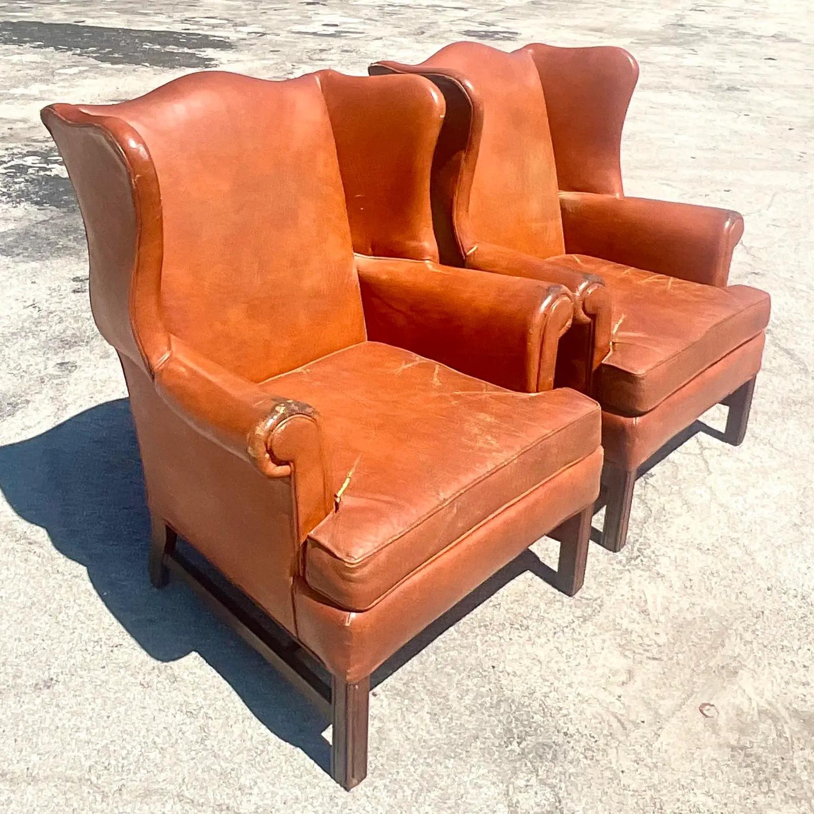 Vintage Boho Distressed Leather Wingback Chairs, a Pair In Good Condition In west palm beach, FL