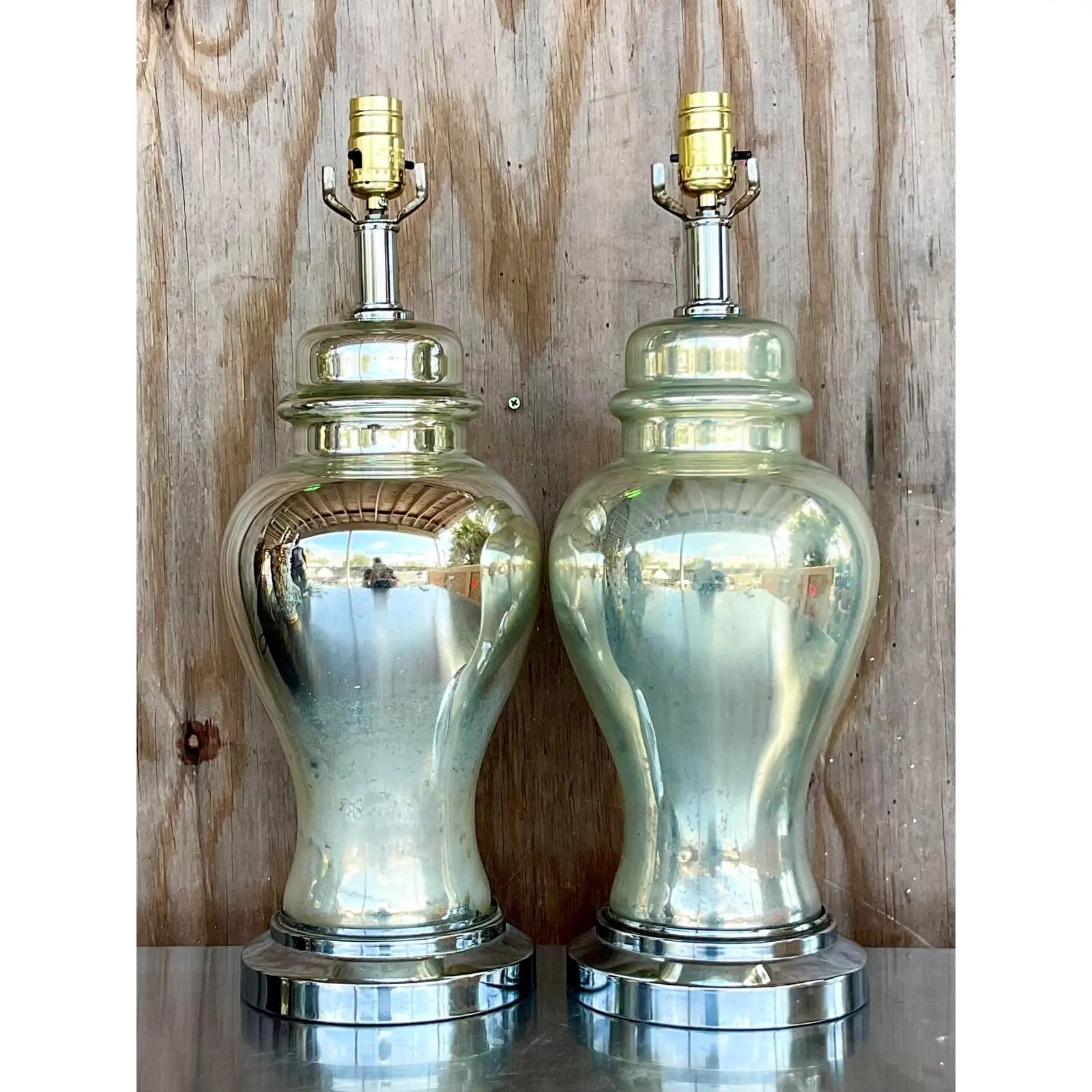 Outstanding pair of vintage Boho table lamps. Beautiful ginger jar shape in antique mercury glass. Fabulous distressed patina from the passage of time. Just the most perfect amount. Rest on chrome plinths. Acquired from a Palm Beach estate.