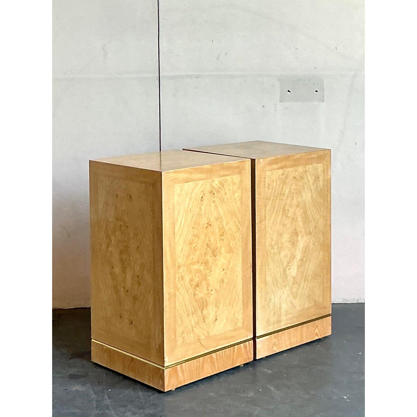 Showcase your finest art or plants with this exceptional pair of vintage pedestals by the celebrated American maker, Drexel Heritage. Each pedestal is a masterclass in minimalist design and luxurious materials, featuring a stunning book-matched burl