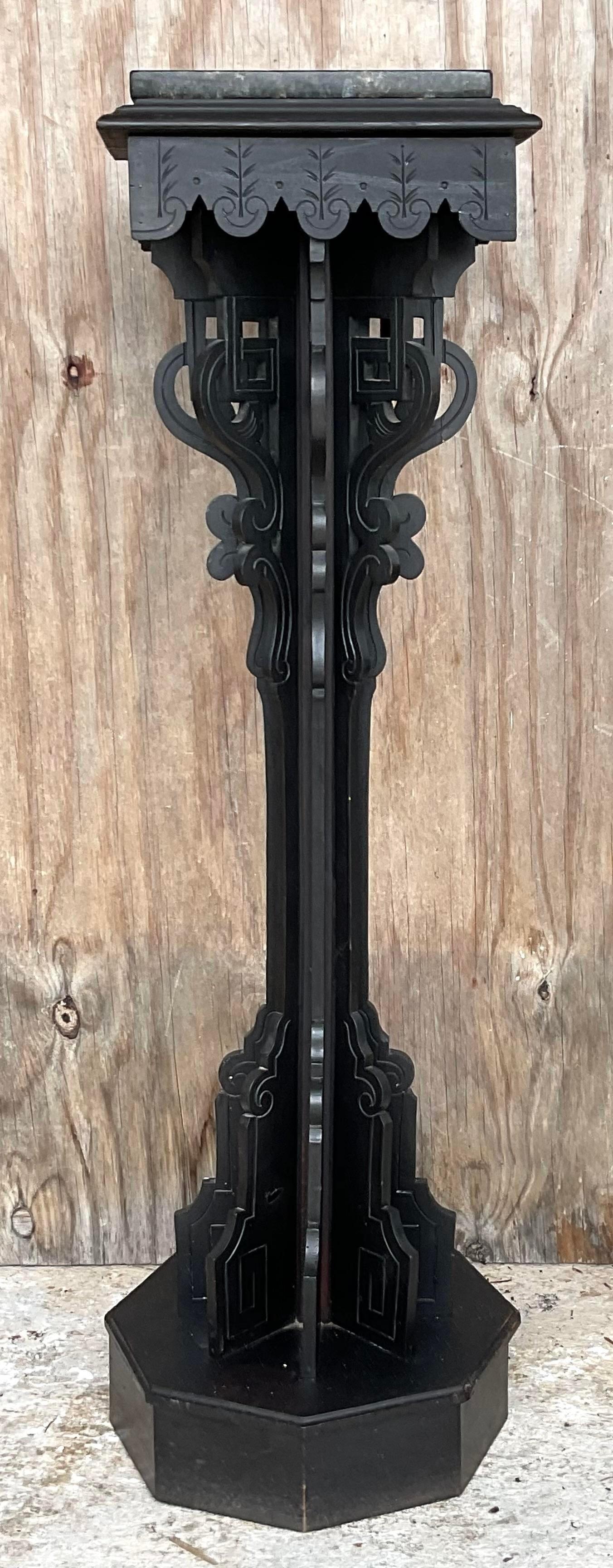 A fantastic vintage Boho wooden pedestal. A classic Eastlake design with the iconic mill work detail. Black stone square rests on top. Acquired from a Palm Beach estate.