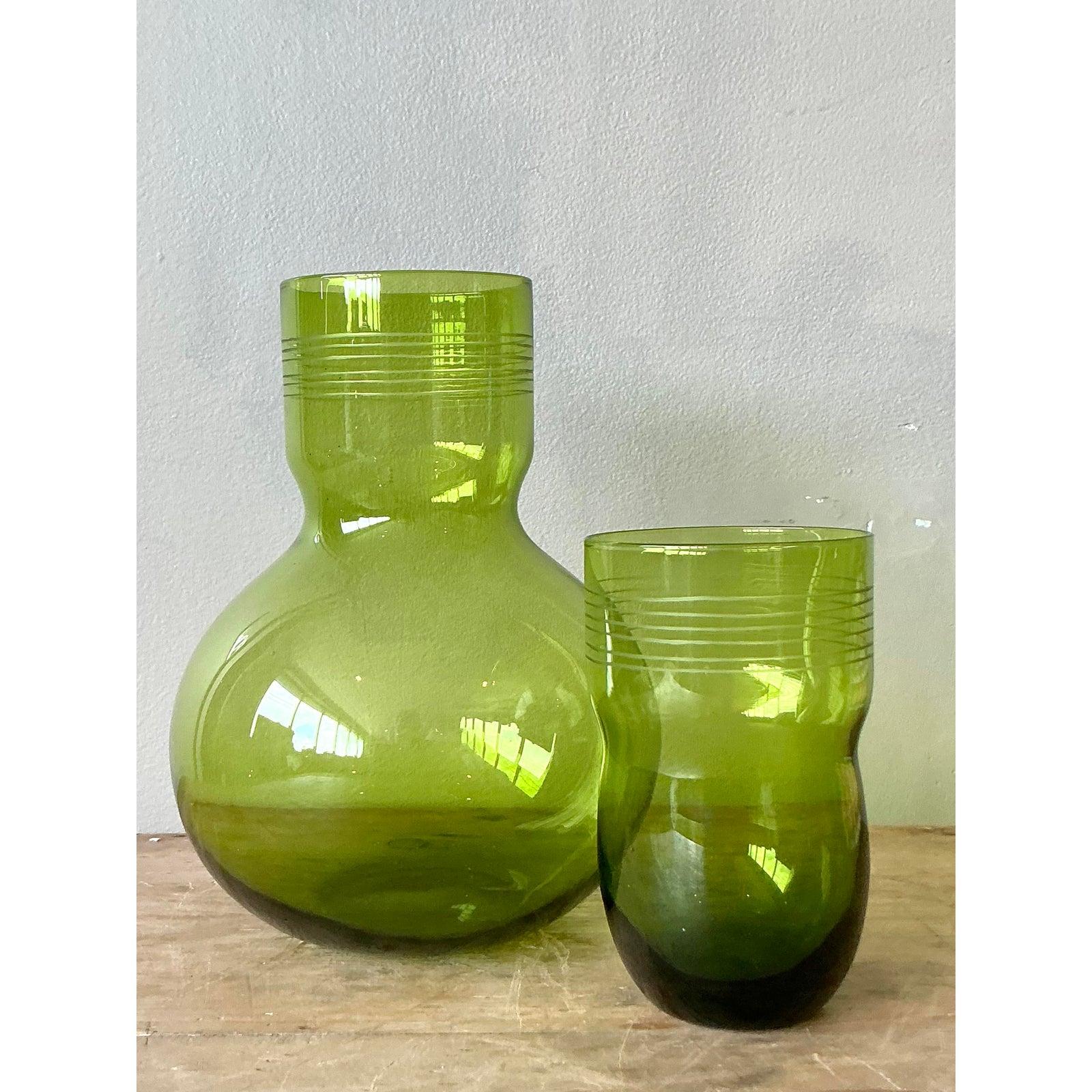 Discover the exquisite charm of this vintage Boho etched bedside water pitcher and accompanying cup, a delightful set designed to bring both functionality and artistic flair to your space. Crafted from vibrant green glass, each piece is adorned with