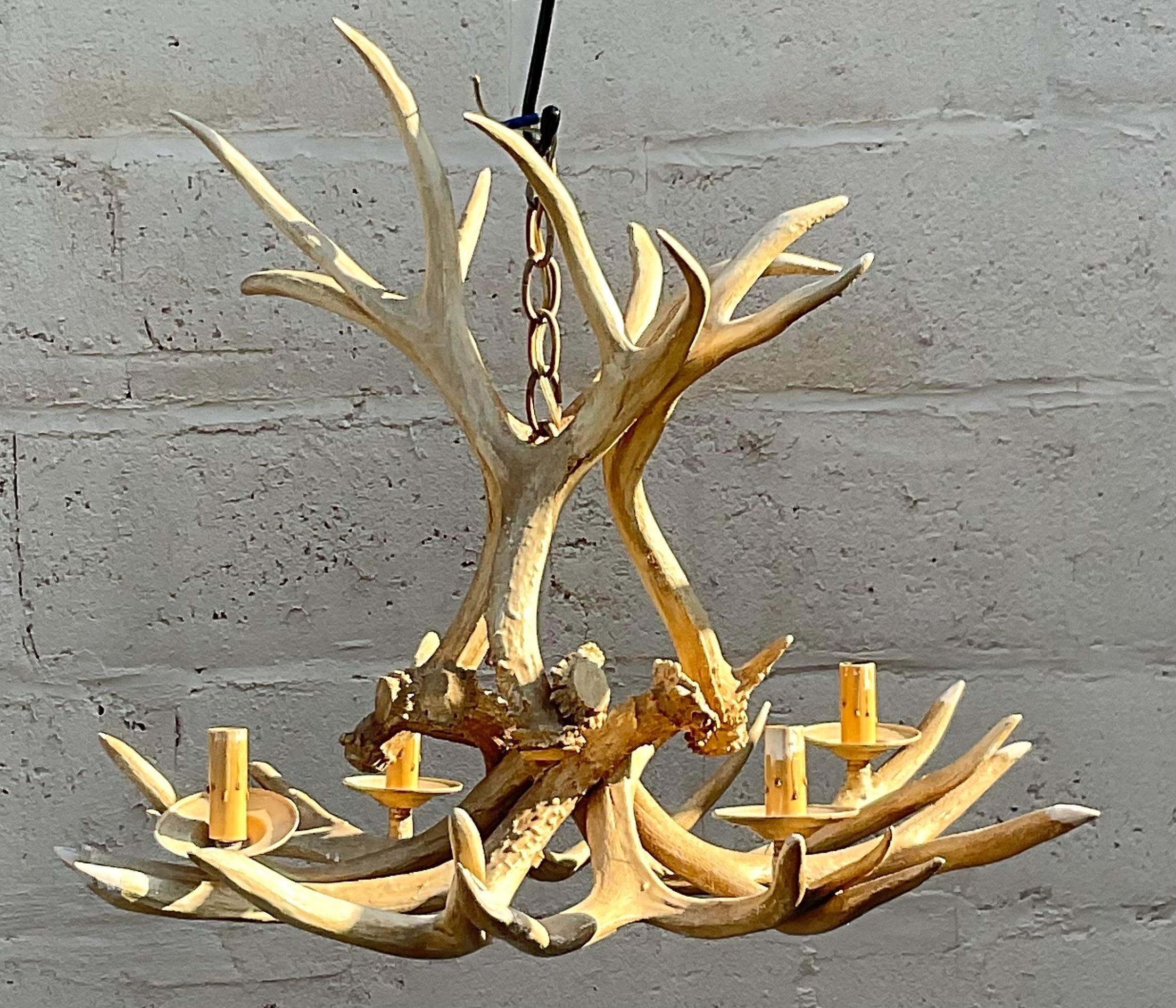 Elevate your decor with our Vintage Boho Faux Antler Chandelier. This unique piece combines rustic charm with Bohemian flair, featuring faux antlers for a touch of wilderness. A standout choice for adding a blend of American ruggedness and eclectic