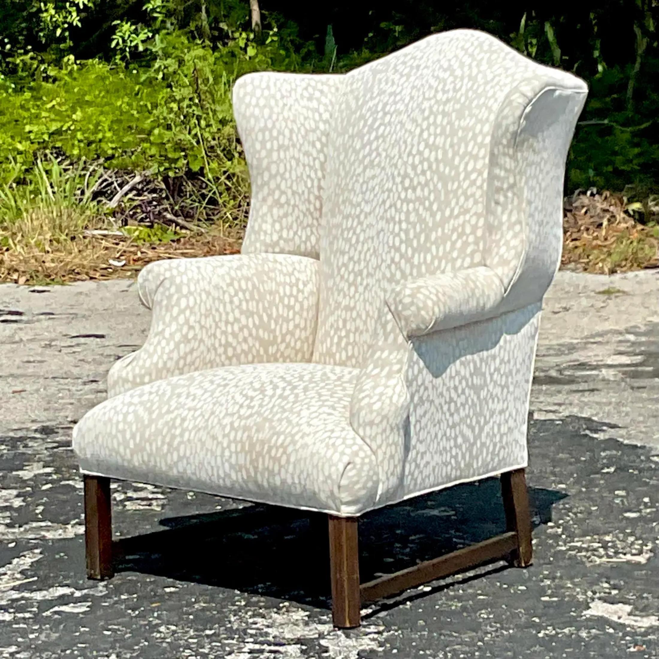A fabulous vintage Boho wingback chair. A chic fawn print design in pale neutral colors. Acquired from a Palm Beach estate
