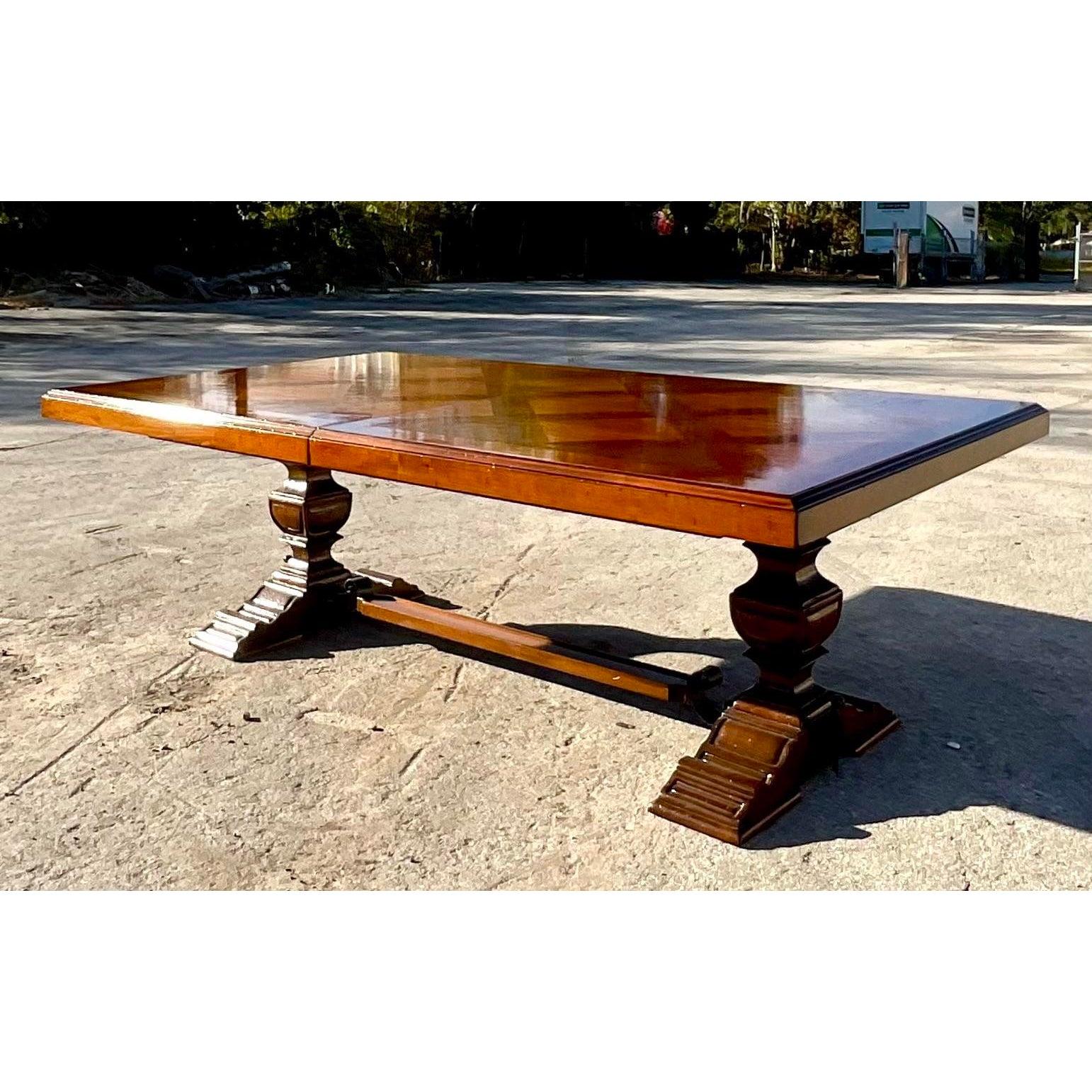 A spectacular Italian Inlay dining table. Made in Italy by the iconic Francesco Molon group. Beautiful wood grain detail with a classic farm table design. Two leaves for a massive dining table. Acquired from a Palm Beach estate.