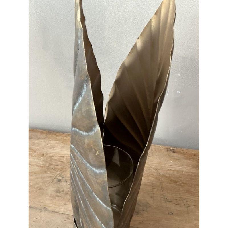 Adorn your walls with this enchanting vintage gilt metal leaf wall sconce, a beautiful blend of natural inspiration and refined elegance. Crafted with meticulous detail, the substantial leaf motif features prominent veining and a rich, antiqued gilt