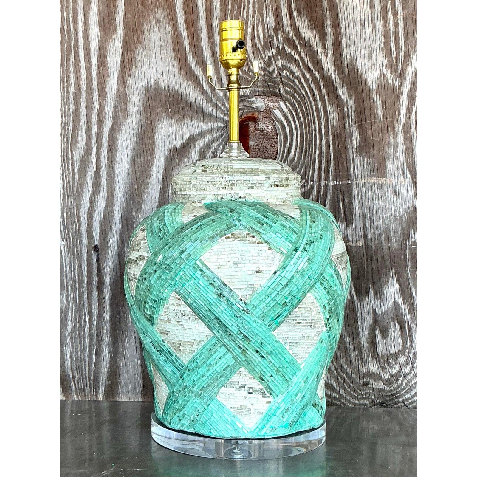 Illuminate your space with the enchanting charm of this Vintage Boho Glass Mosaic Tile Lamp, a stunning piece that blends artistry and functionality. Handcrafted with a mesmerizing lattice of seafoam green and ivory glass tiles, its urn-shaped