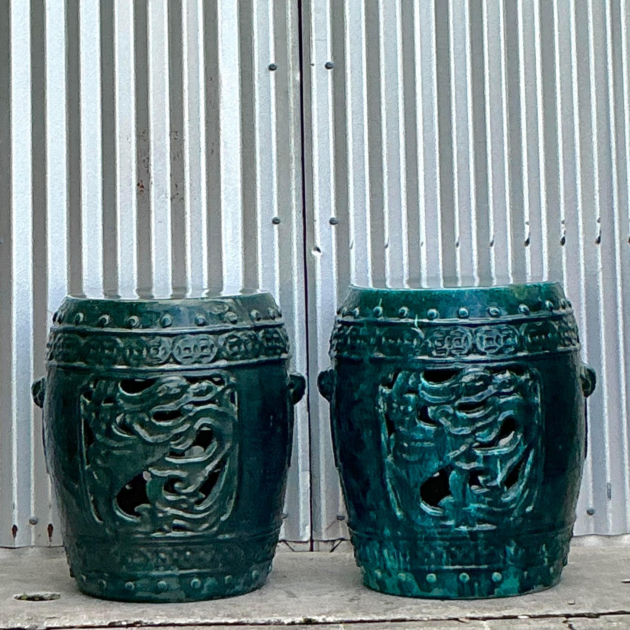 Add an exotic touch to your décor with this striking pair of Vintage Boho Glazed Ceramic Dragon Garden Stools. Featuring intricately sculpted dragon motifs, these stools are beautifully glazed in rich, vibrant hues that highlight their stunning