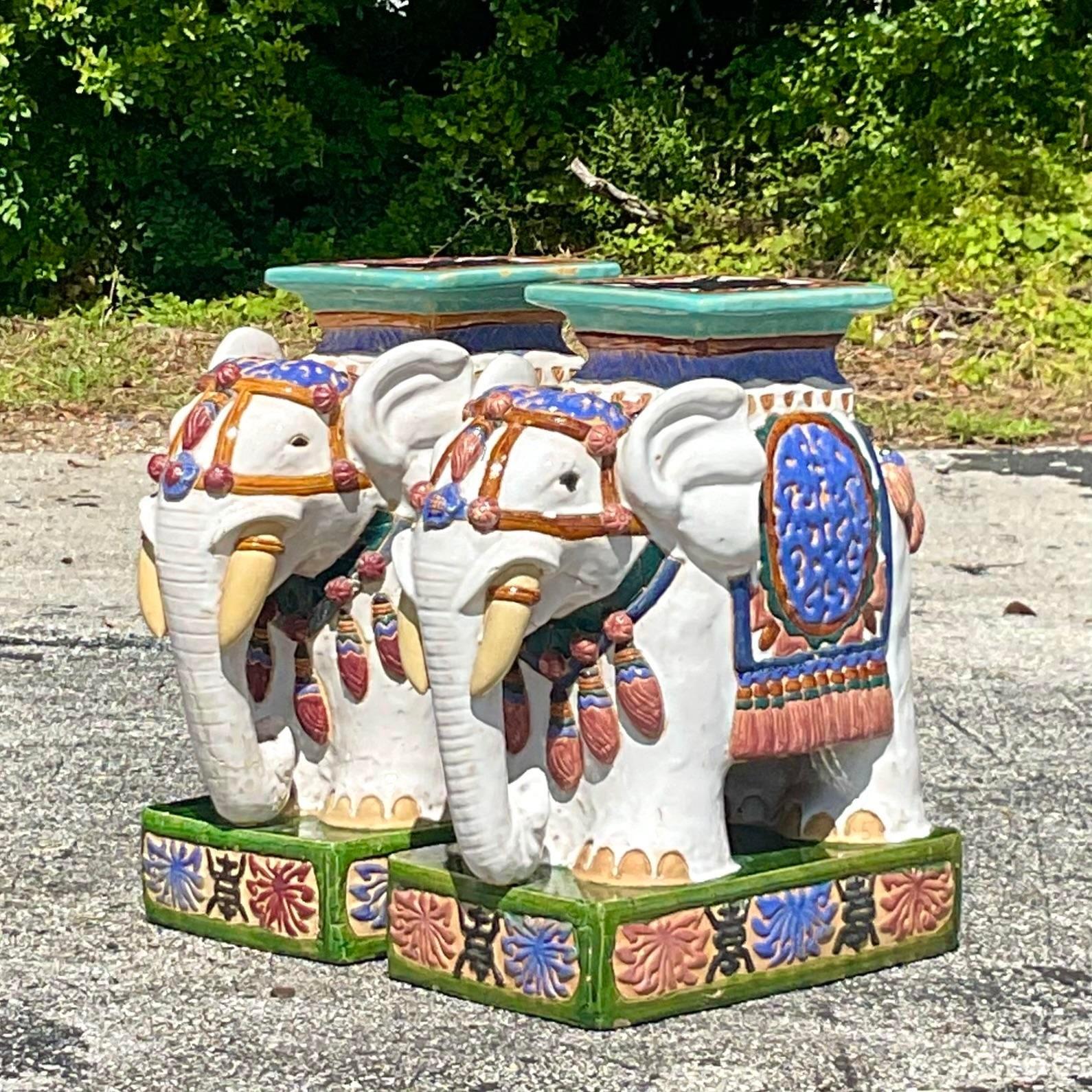 A fabulous pair of vintage low stools. The iconic elephant design in bright clear colors. The coveted XL size. Perfect indoors or outside. You decide! Acquired from a Palm Beach estate
