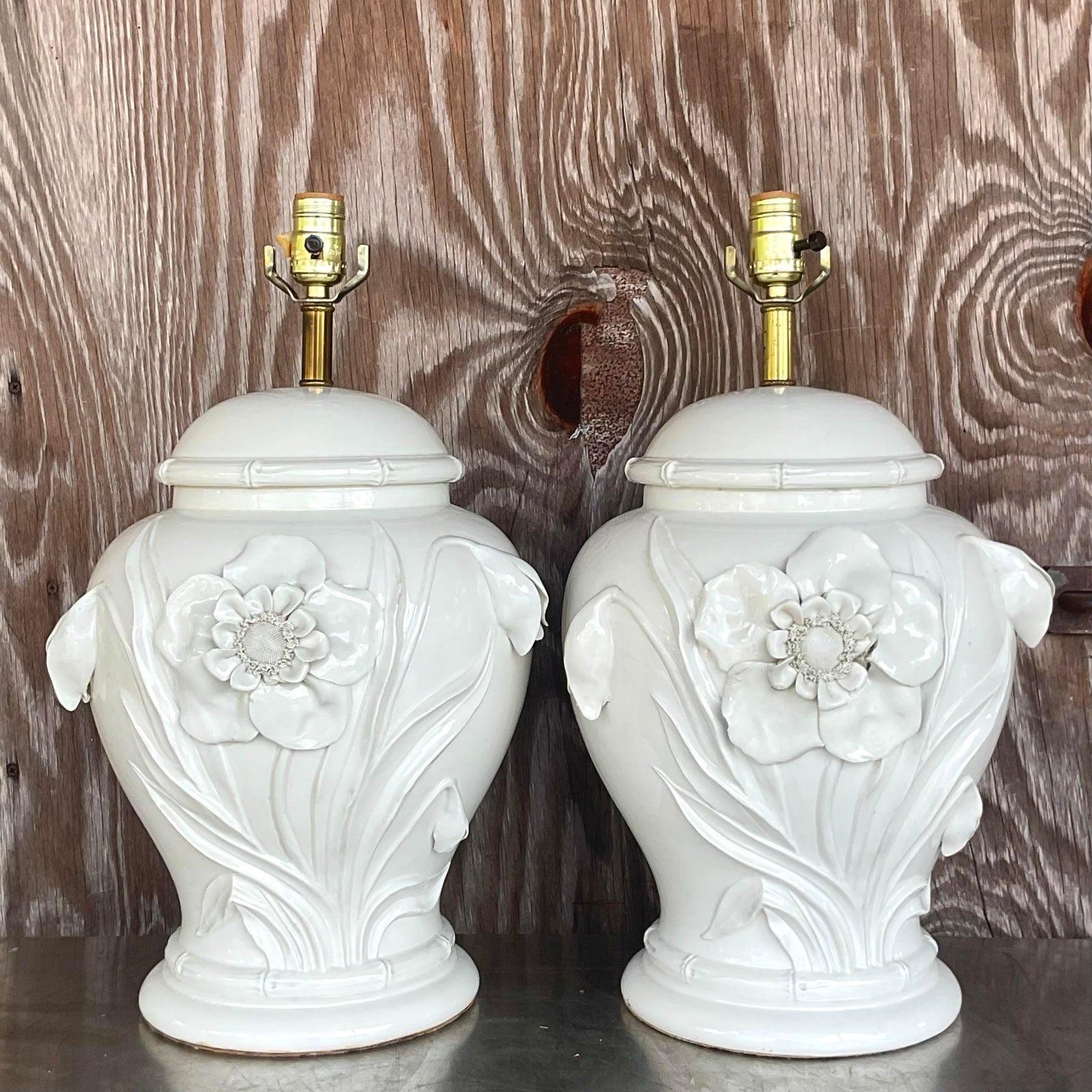 A striking pair of vintage Boho table lamps. Chic hand built flowers on a ginger jar shape. An off white glazed ceramic finish. Acquired from a Palm Beach estate