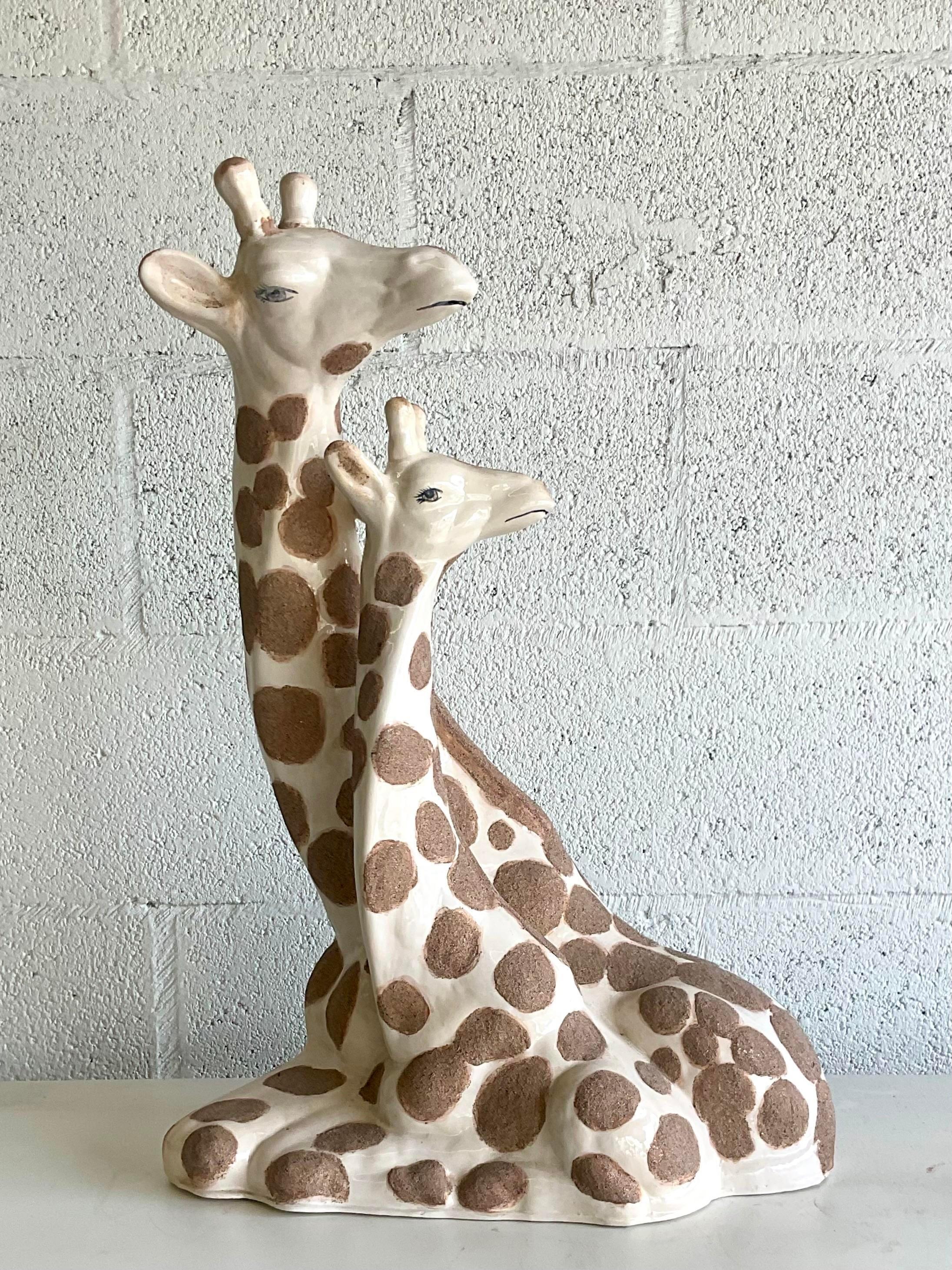 Fabulous vintage MCM giraffes. Beautiful hand painted detail with a textured spots all over the bodies. The giraffes are a single piece. Acquired from a Palm Beach estate. l